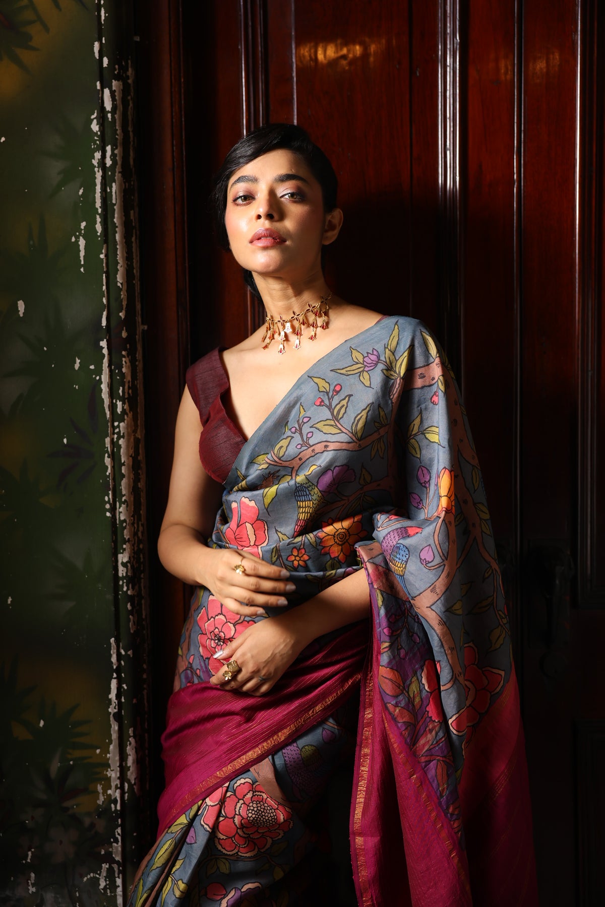A korvai contemporary kanchivaram silk saree one sided border adorned with chintz penkalamkari