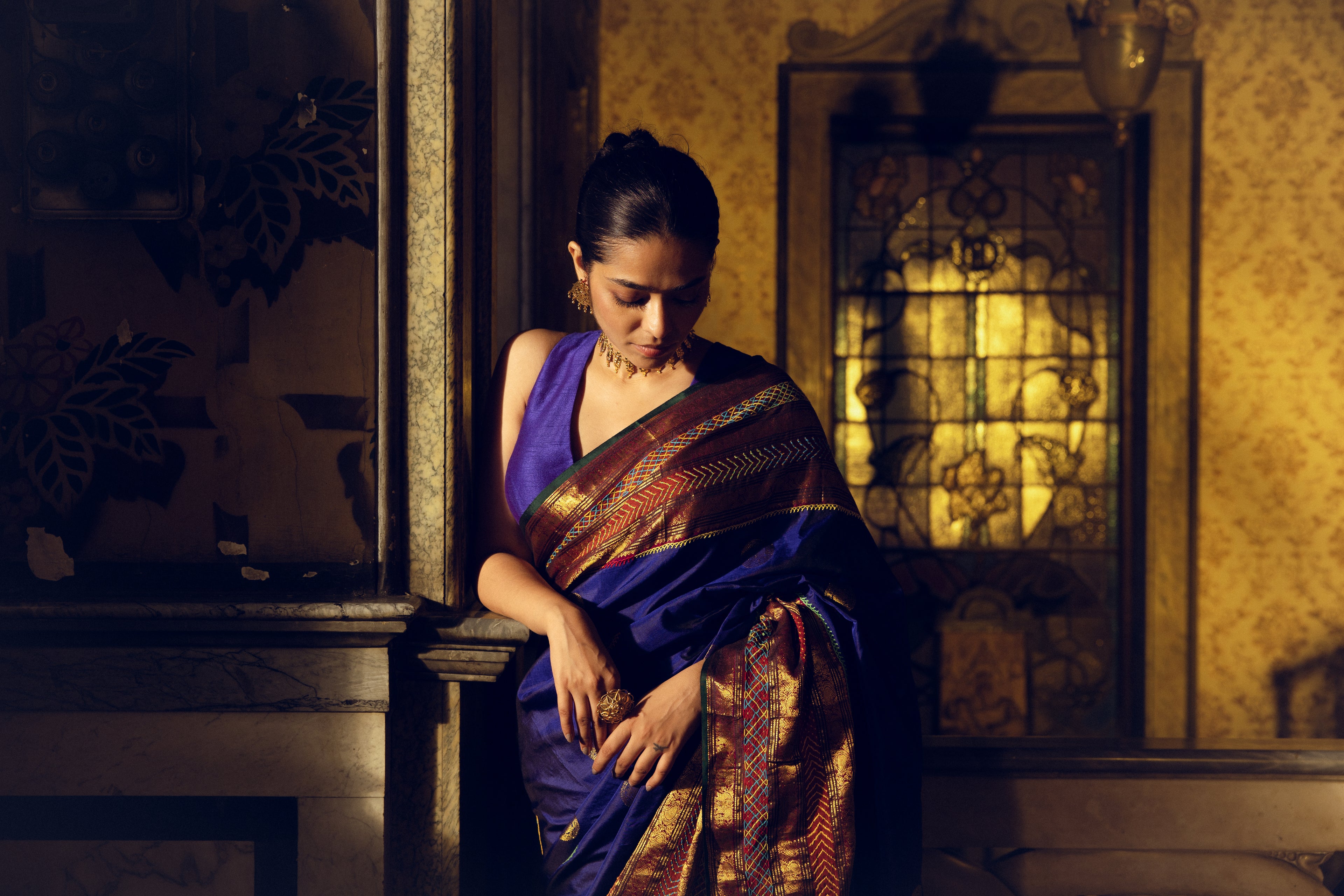 Handwoven pure kanchivaram silk saree blue with purple shot adorned with an exquisite handmade lambani mirror work