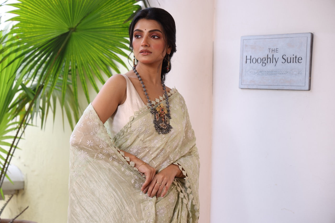A stunner exclusive designer collective Matcha green all over Chikankari work on handwoven tissue silk