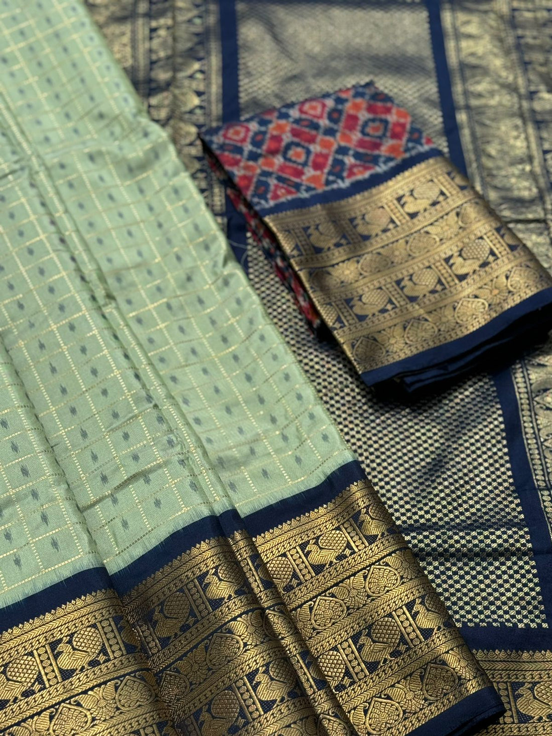 A masterpiece pastel green Zari checks with ikkat patola inspired ikkat with kanchi fusion pure handwoven silk saree