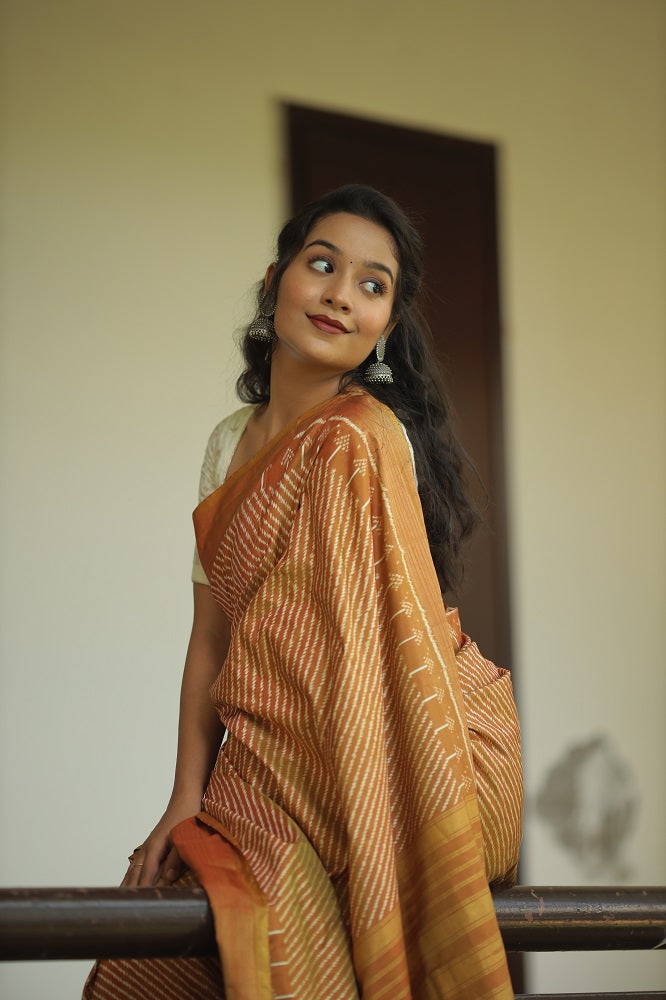 Natural Dye Silk Ikkat Saree In Lehariya Pattern In muted Gold Shade