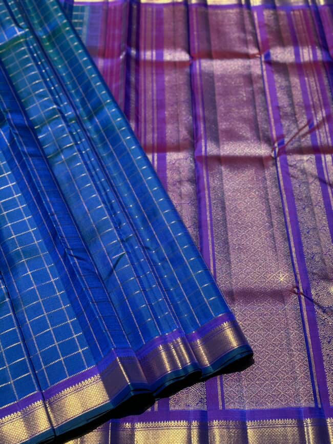 A stunner muthuseer zari kattam kanchivaram silk saree pure handwoven in a peacock blue