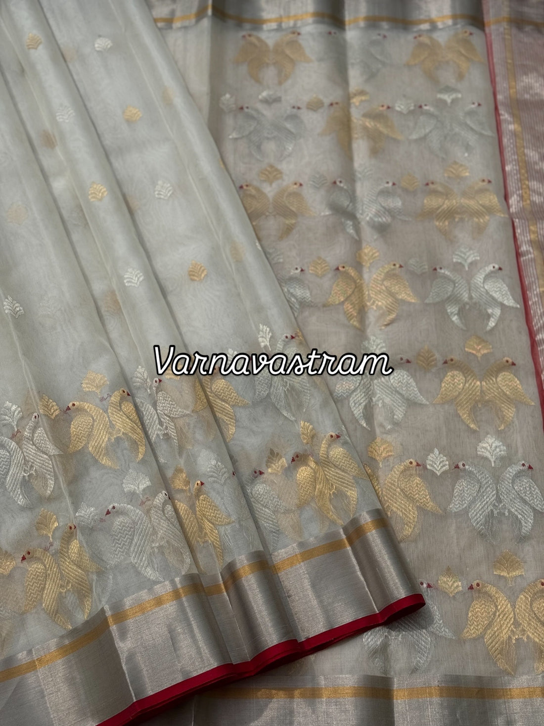 A ivory white handwoven chanderi silk saree with full jaal weave ek naal and meenakari
