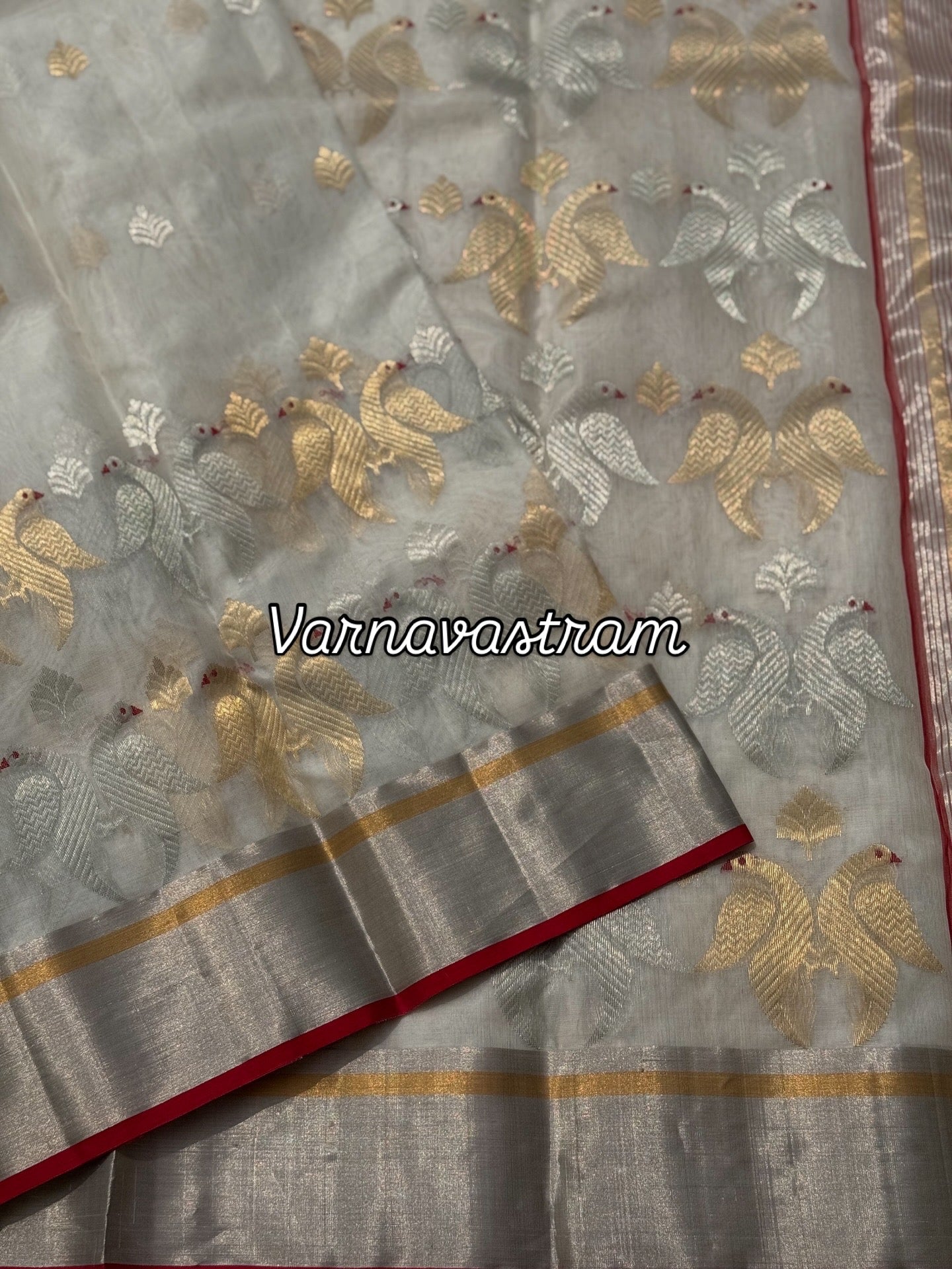 A ivory white handwoven chanderi silk saree with full jaal weave ek naal and meenakari