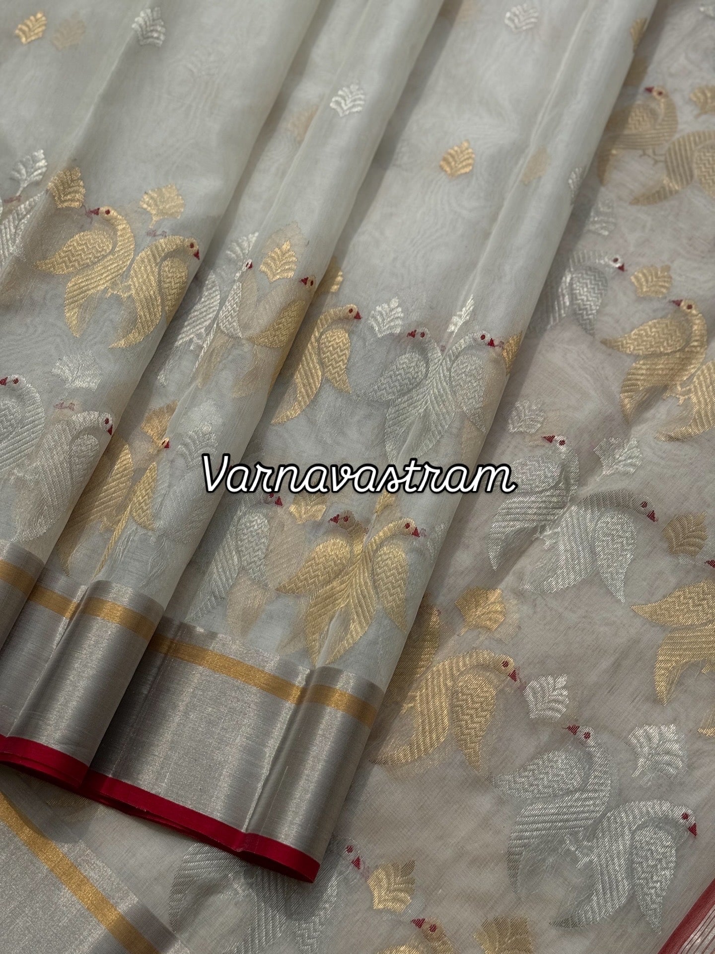 A ivory white handwoven chanderi silk saree with full jaal weave ek naal and meenakari