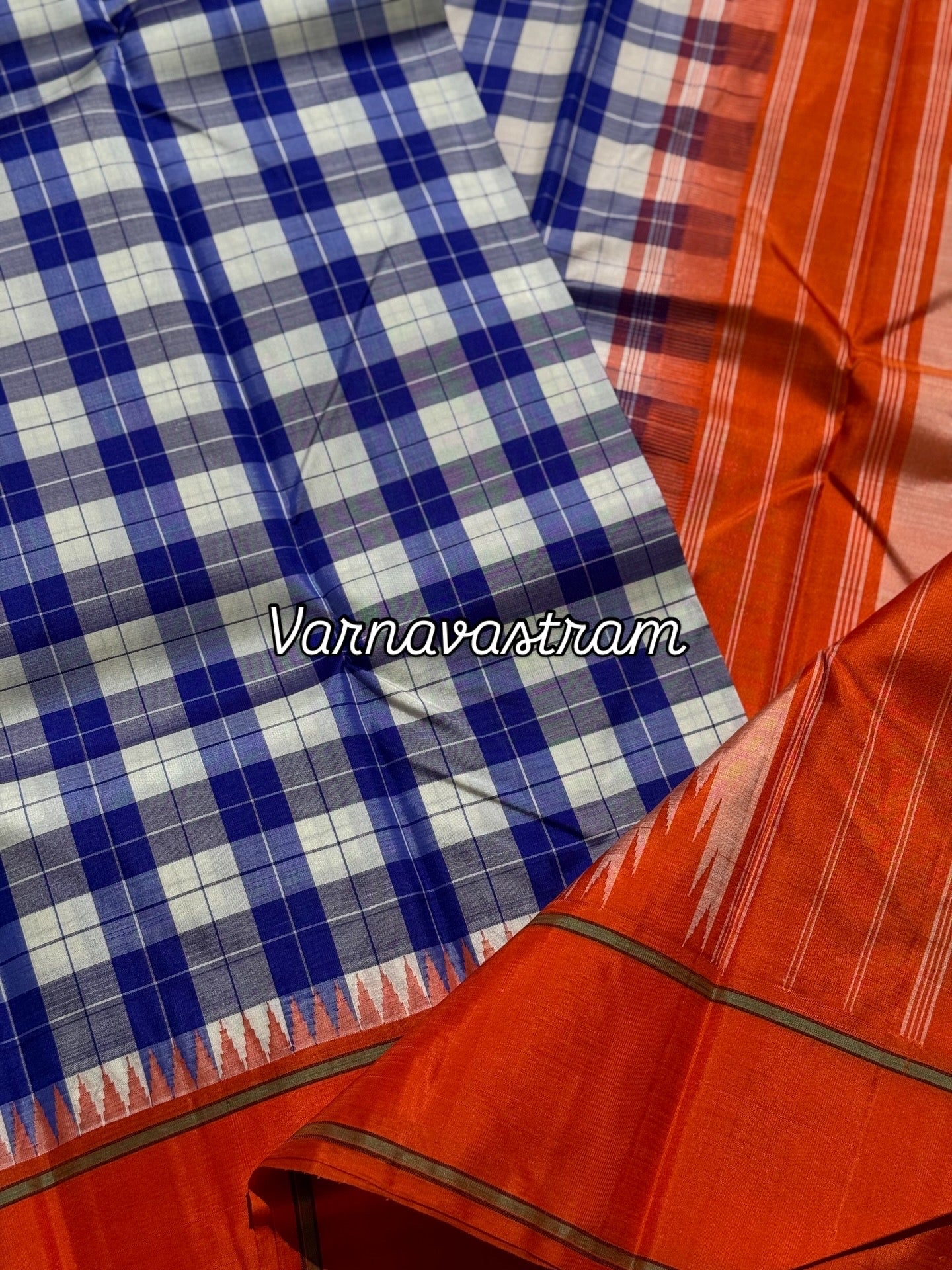 A gorgeous blue with offwhite Burberry checks temple korvai kanchivaram silk saree