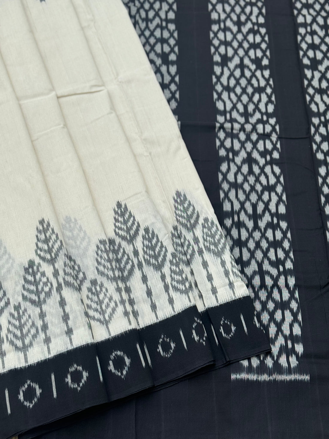 Ivory and black handwoven weft single ikkat cotton saree