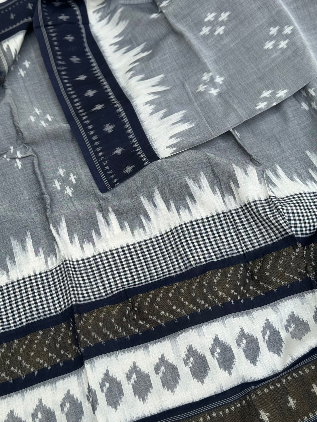 Ivory with deep navy blue zari border handwoven weft single ikkat cotton saree