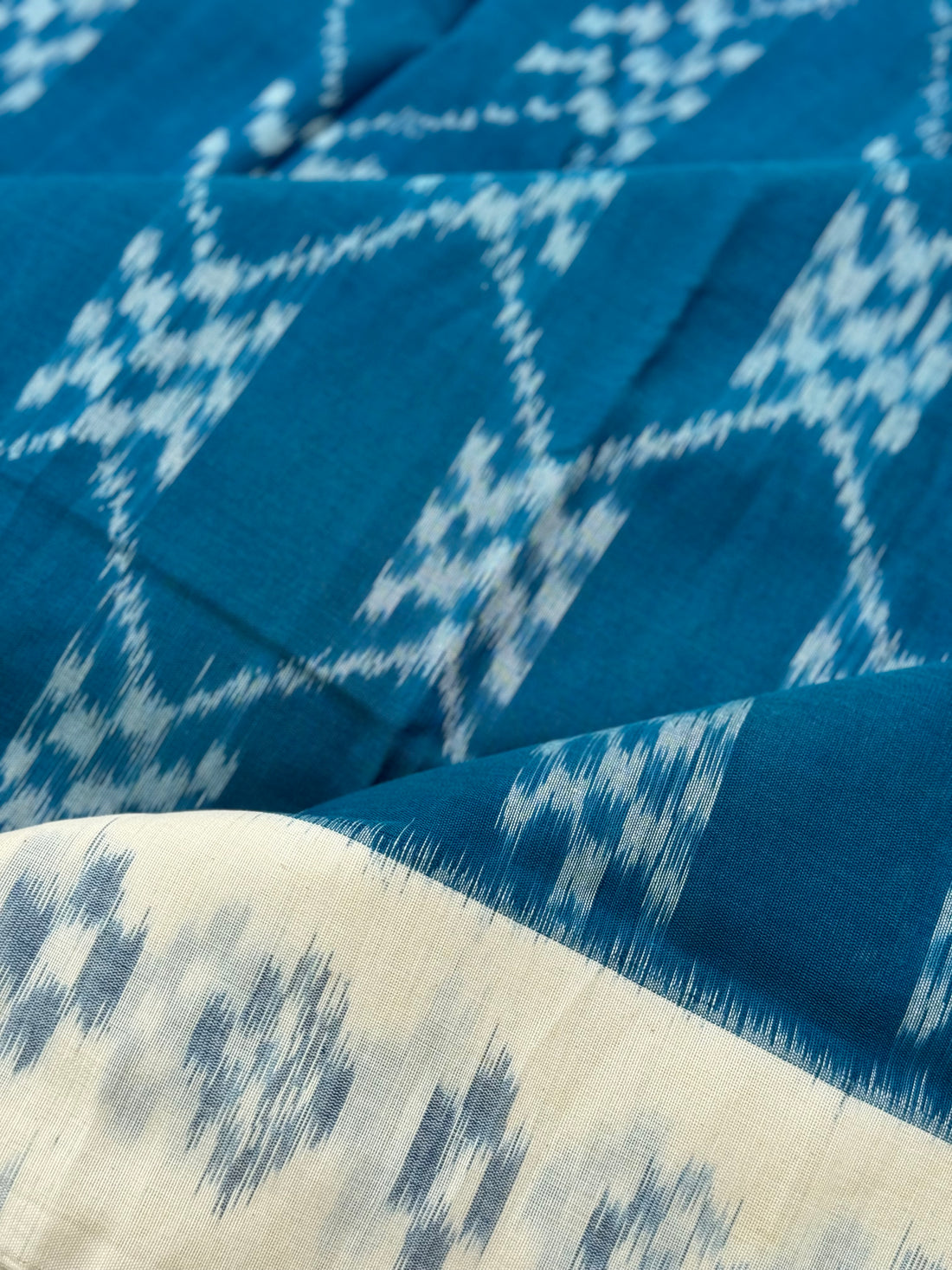 Ivory white w handwoven weft single ikkat cotton saree