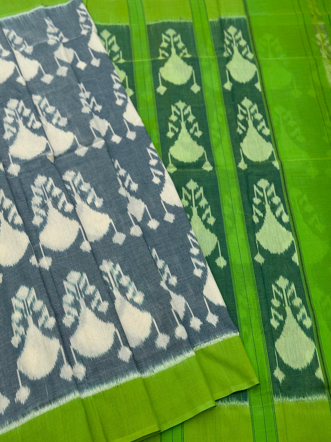 Powder blue with green Uzbek motifs single ikkat cotton saree