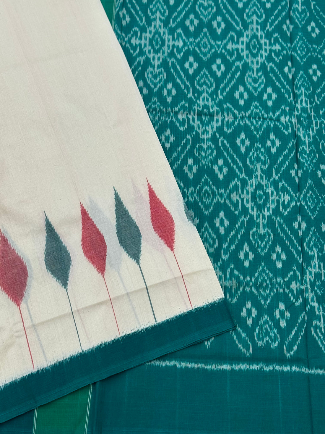 Ivory and teal handwoven weft single ikkat cotton saree