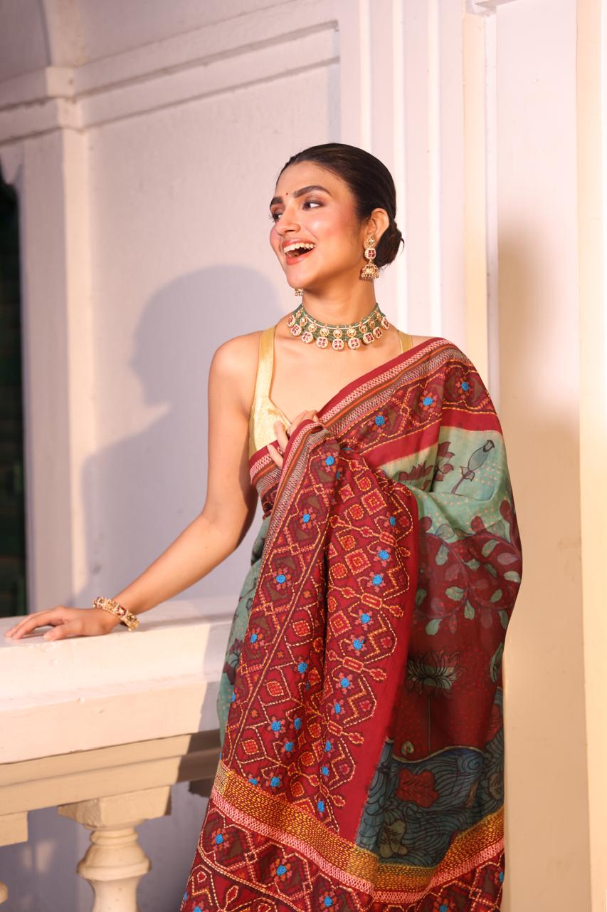 Handdrawn handpainted penkalamkari on handknotted Bhandej body with Katha handembroidery on a patola silk ikkat saree