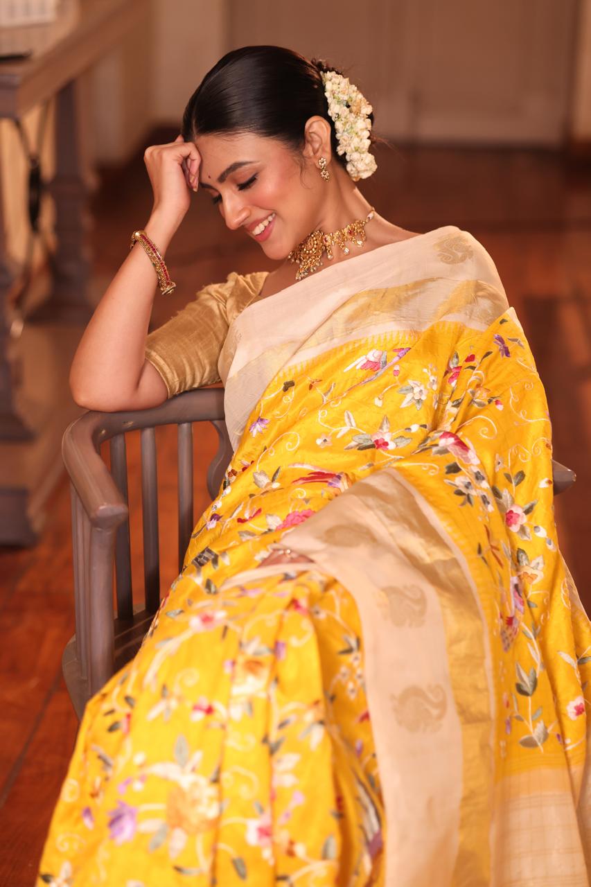 A pastel yellow Masterpiece kanchivaram weave silk saree with authentic Parsi gara work