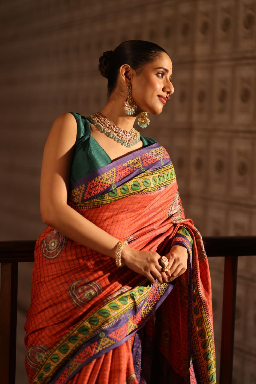 Block prints and kutch mirrorwork highlights on zari woven tussar silk saree