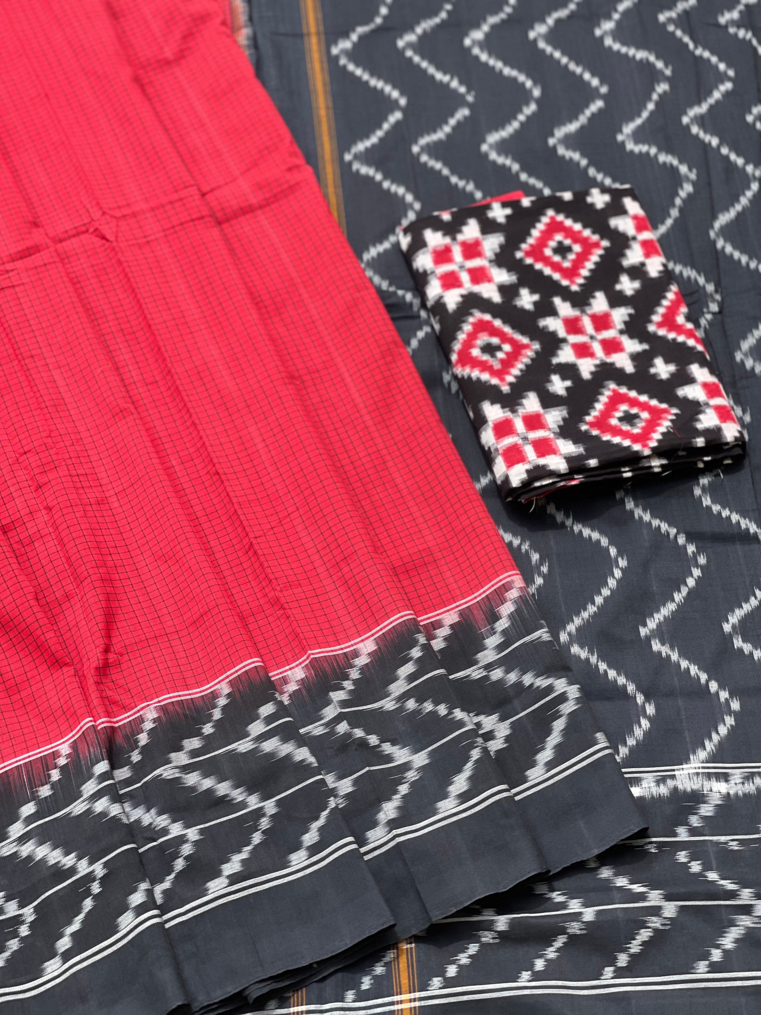 A Red checkered weft ikkat cotton Saree with chevron black border