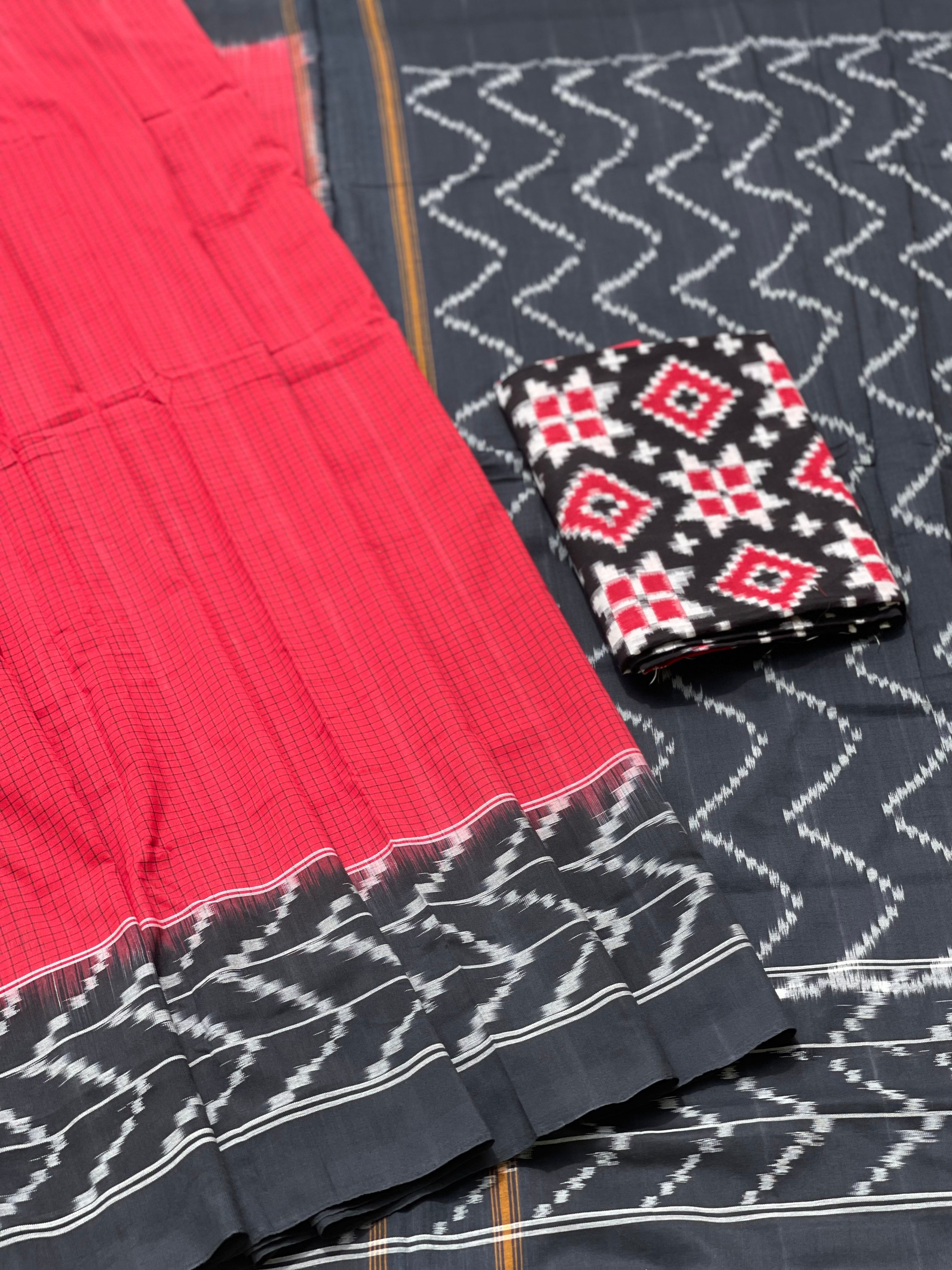 A Red checkered weft ikkat cotton Saree with chevron black border