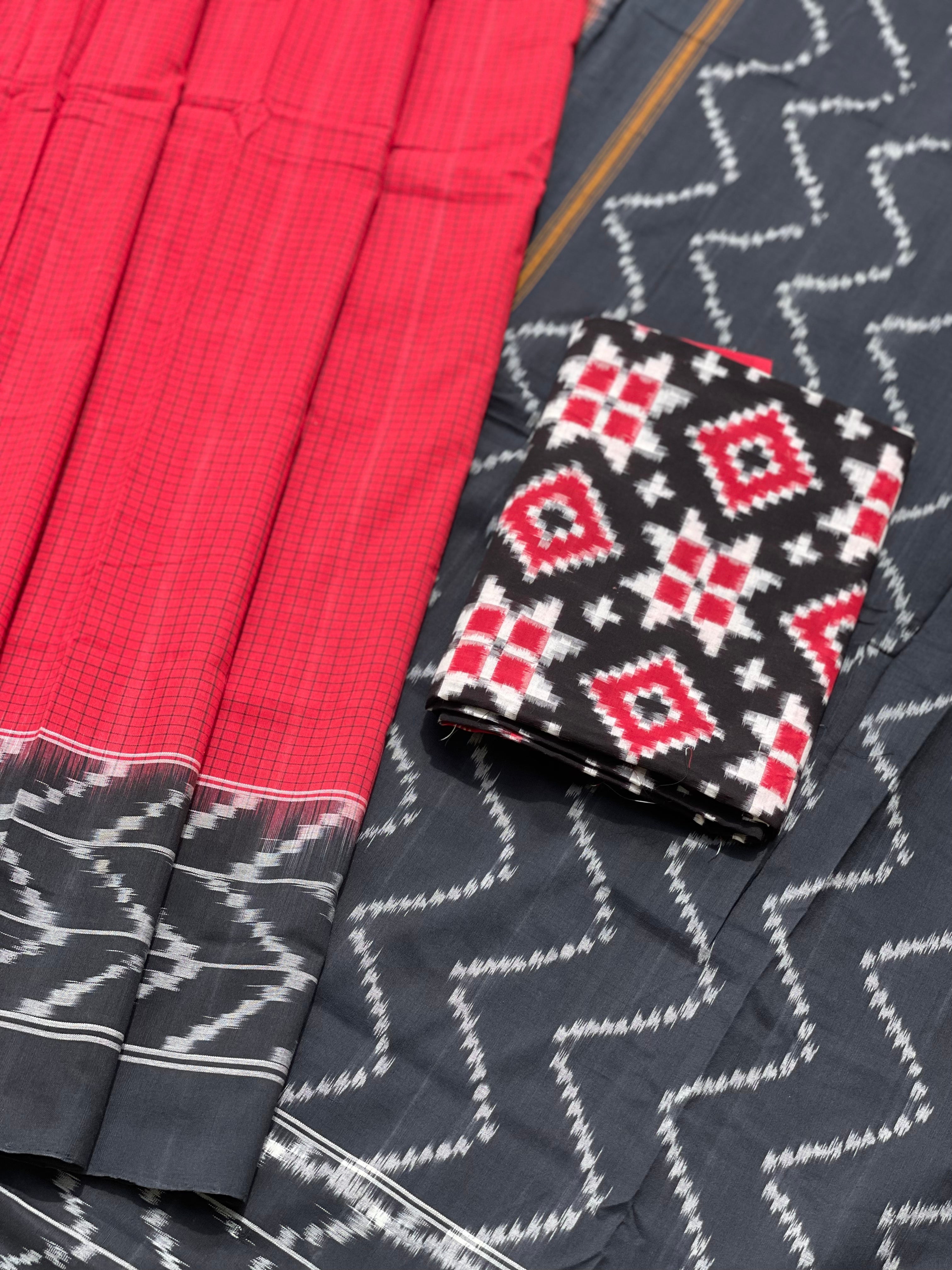 A Red checkered weft ikkat cotton Saree with chevron black border