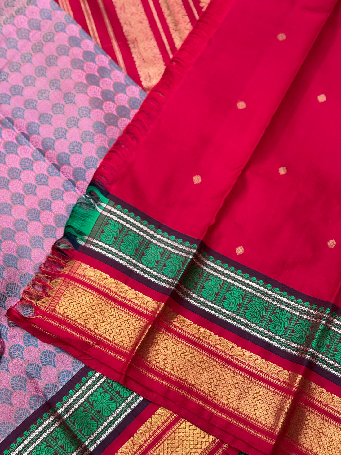 A stunner Masterpiece double border kanchivaram woven silk saree in mauve pink green red