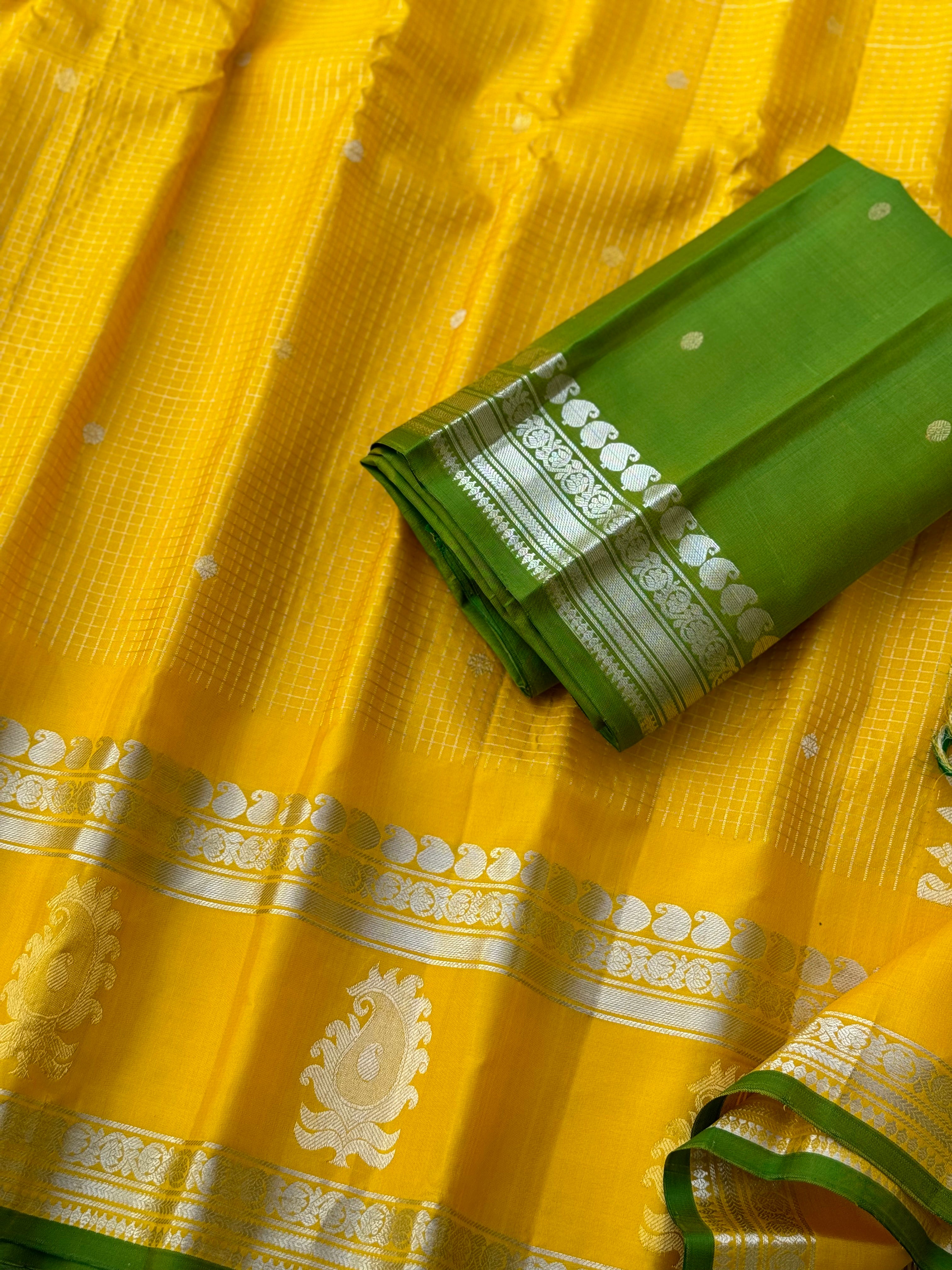 The complete handwoven lemon yellow silver zari checks pure gadwal silk saree