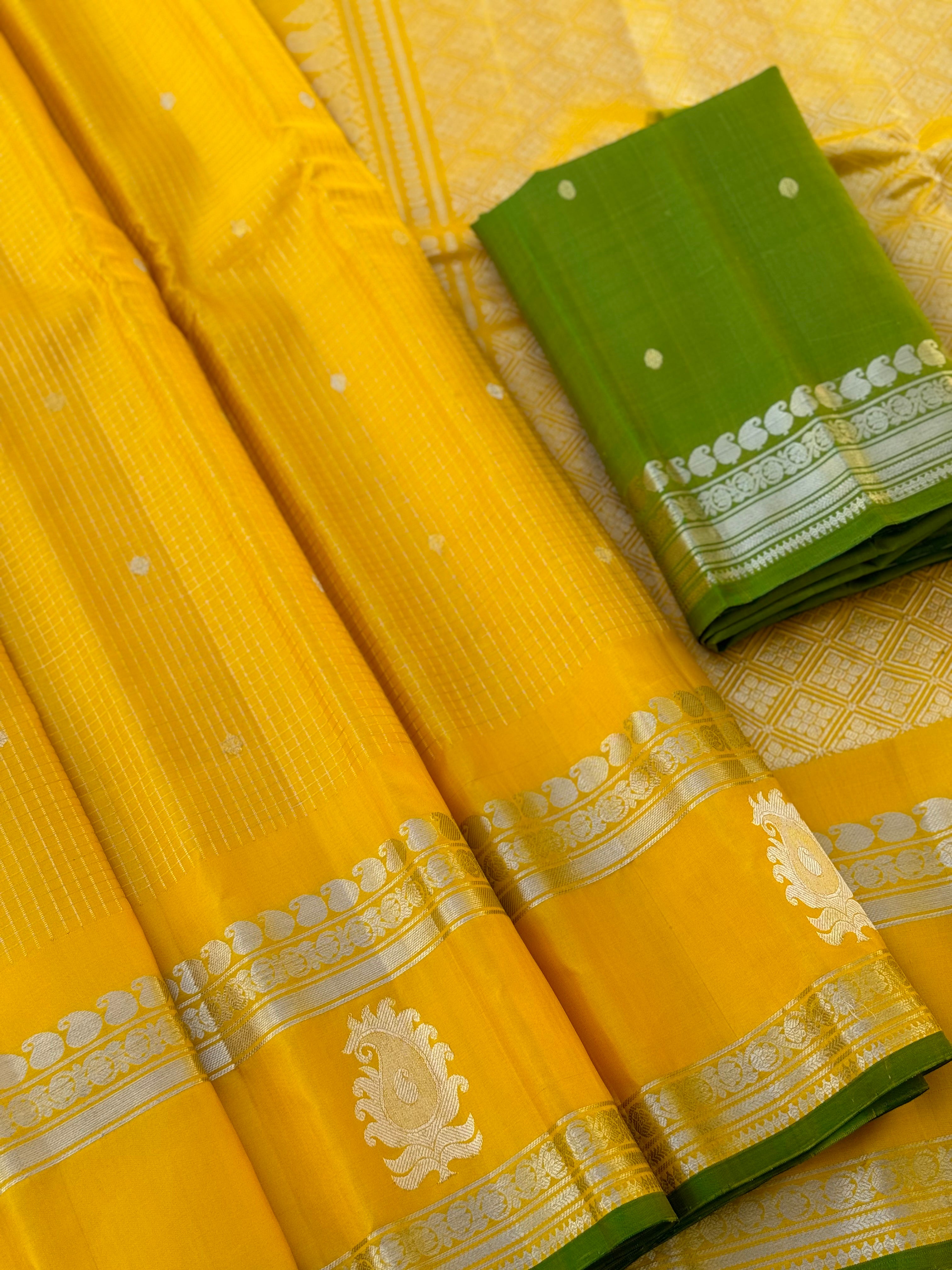 The complete handwoven lemon yellow silver zari checks pure gadwal silk saree