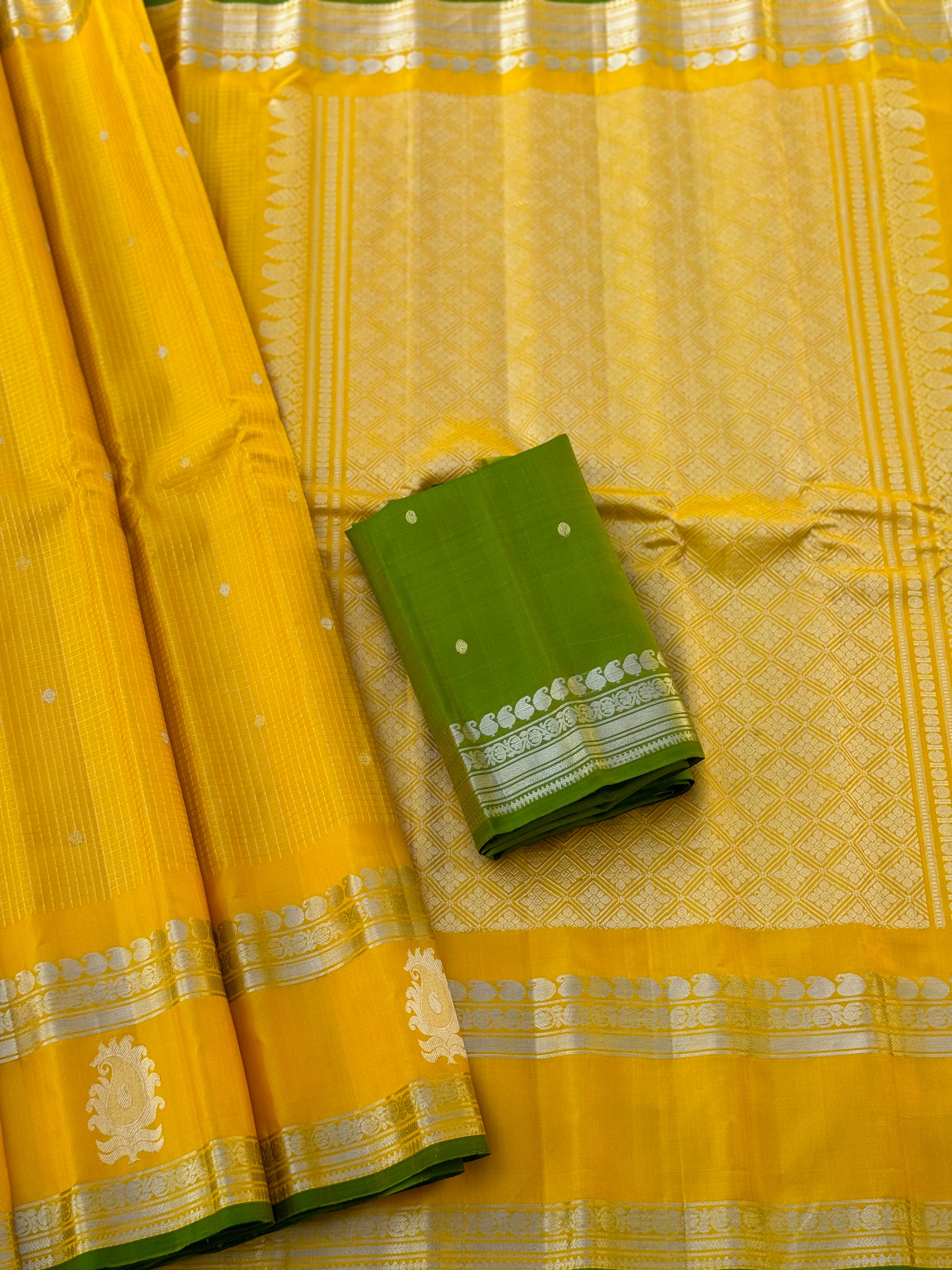 The complete handwoven lemon yellow silver zari checks pure gadwal silk saree