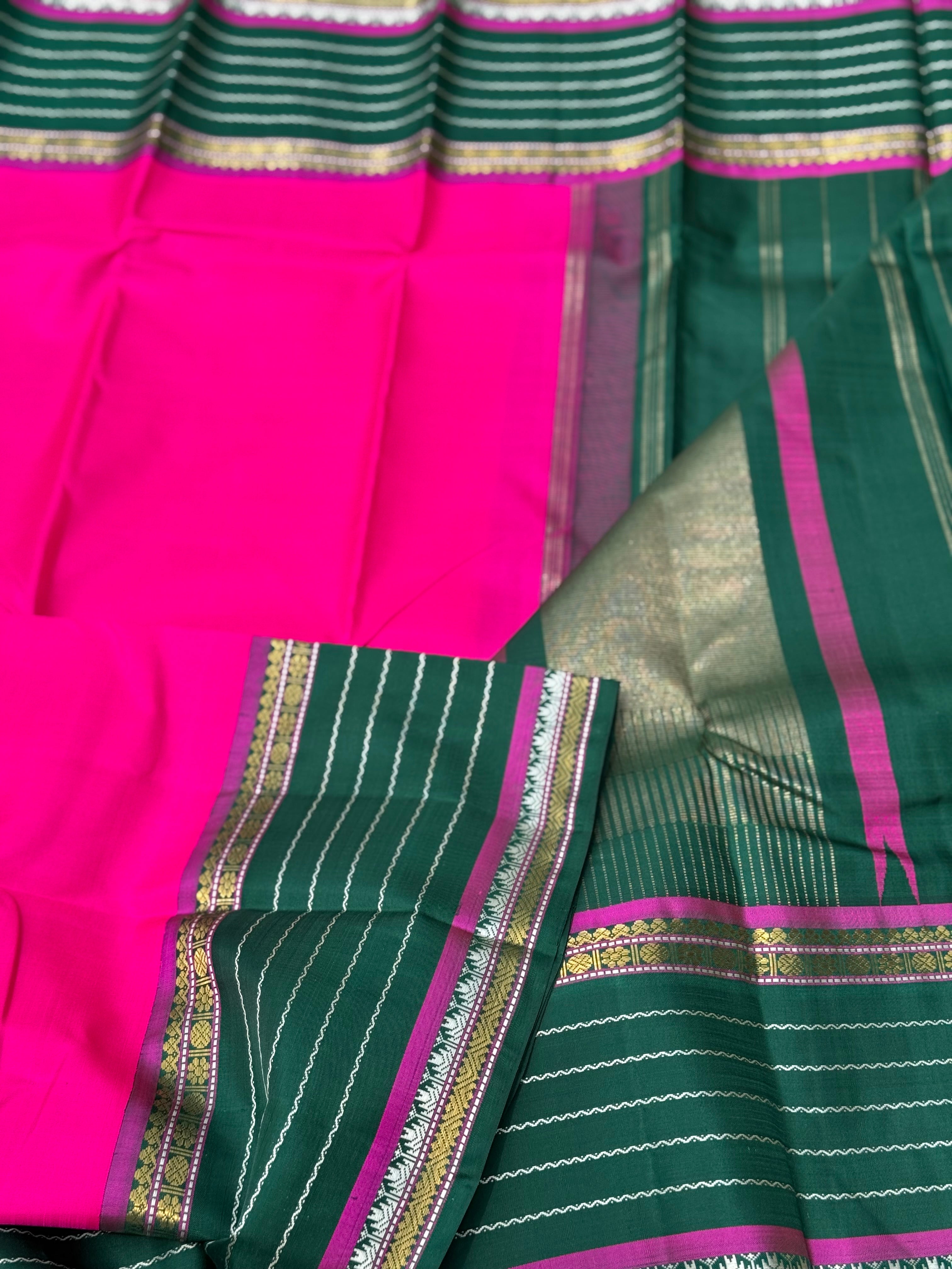 The masterfully crafted neli veldhari Kanchivaram silk saree features subtle pattu rose pink