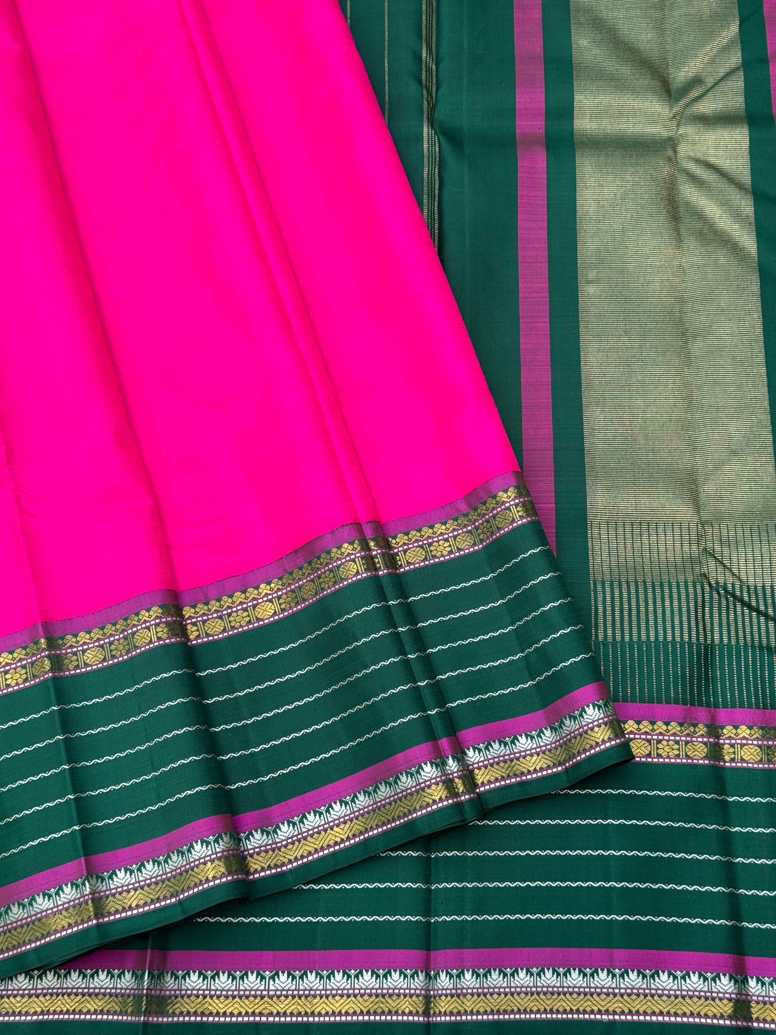 The masterfully crafted neli veldhari Kanchivaram silk saree features subtle pattu rose pink