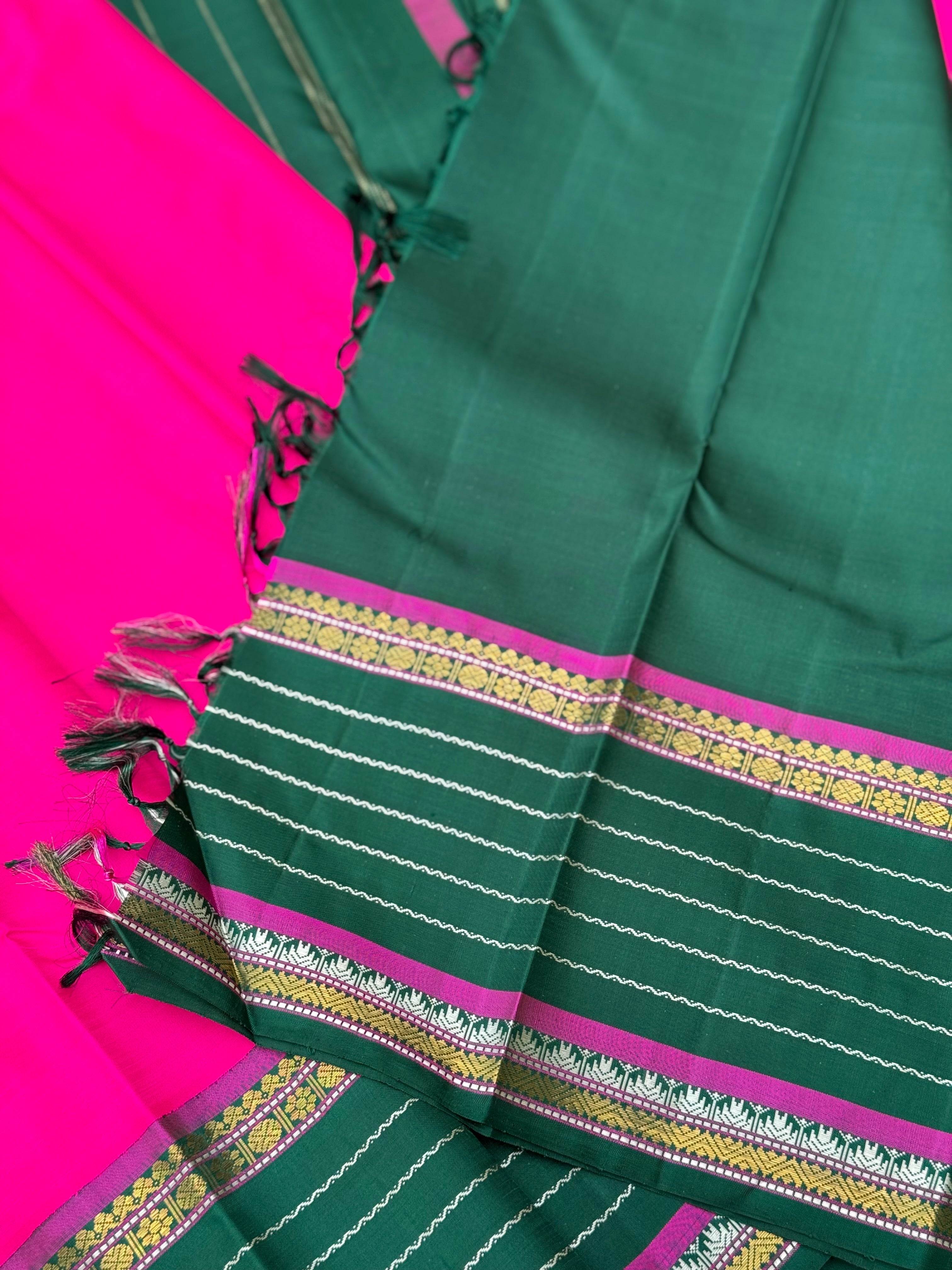 The masterfully crafted neli veldhari Kanchivaram silk saree features subtle pattu rose pink