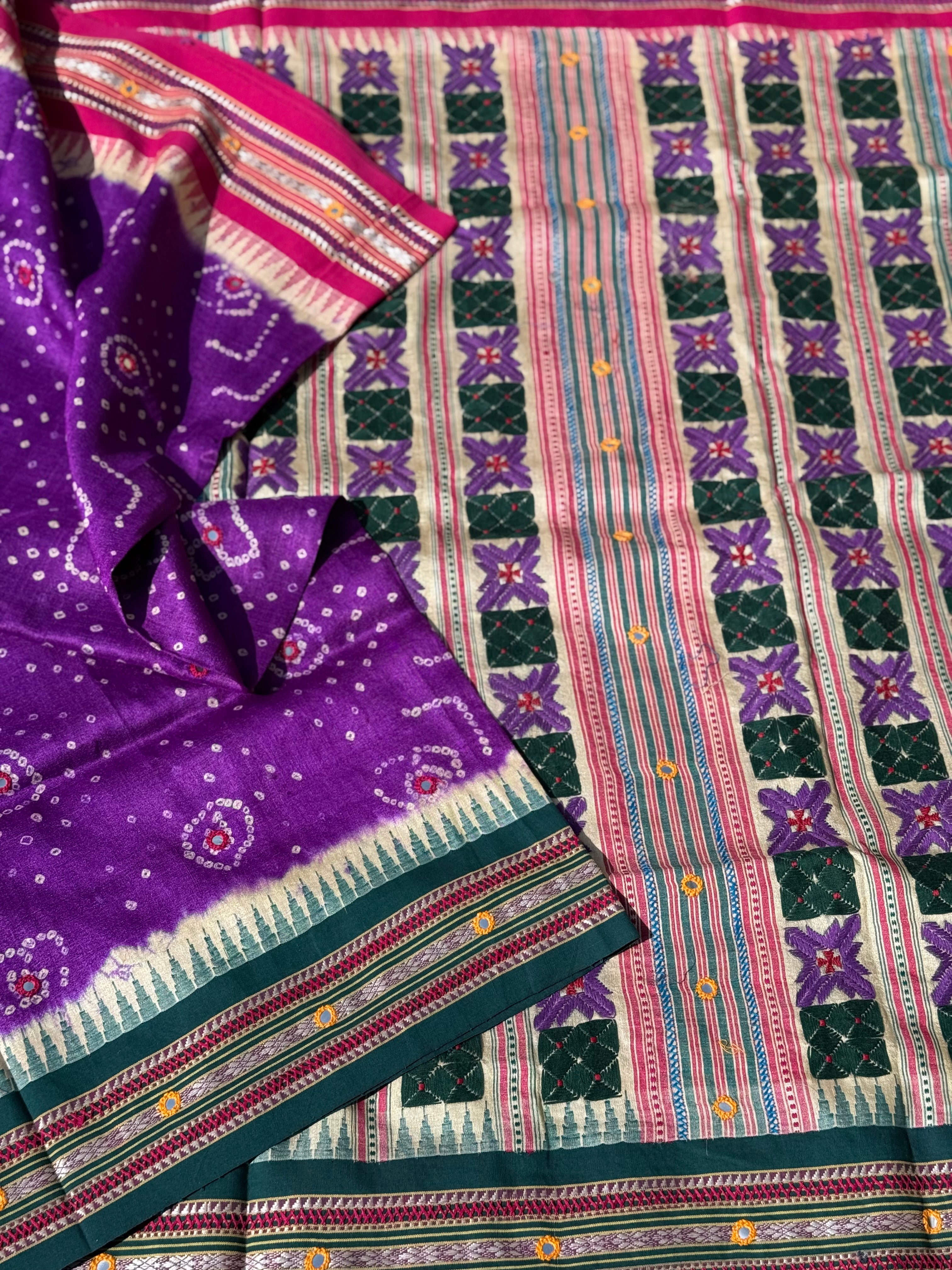 An exquisite handwoven vidharbha tussar silk saree with karvati kinar border intricately tie dyed with brinjal purple blue bhandhej and phulkari hand embroidered