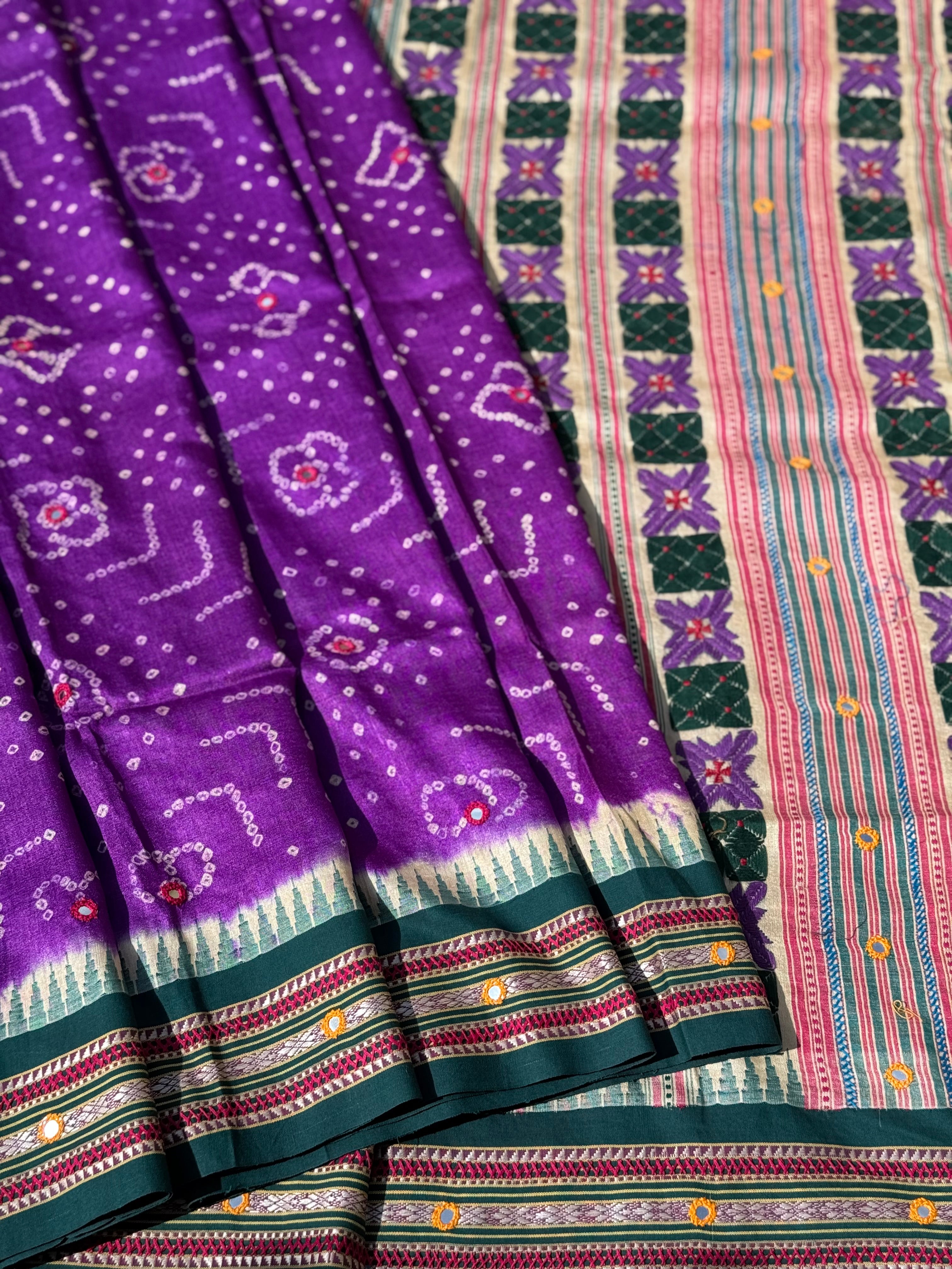 An exquisite handwoven vidharbha tussar silk saree with karvati kinar border intricately tie dyed with brinjal purple blue bhandhej and phulkari hand embroidered