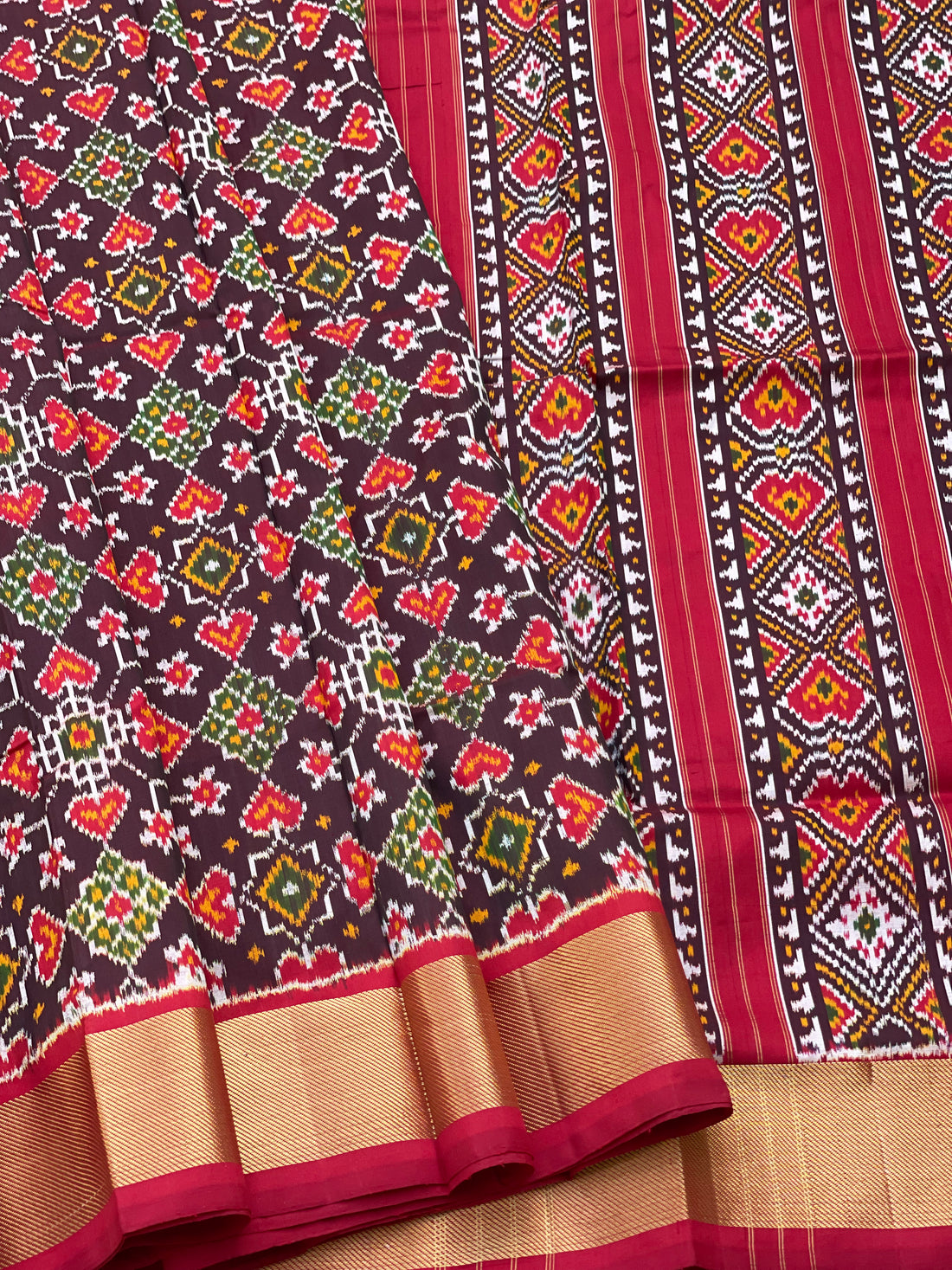 A Traditional Patola inspired silk ikkat saree with navrathan motifs