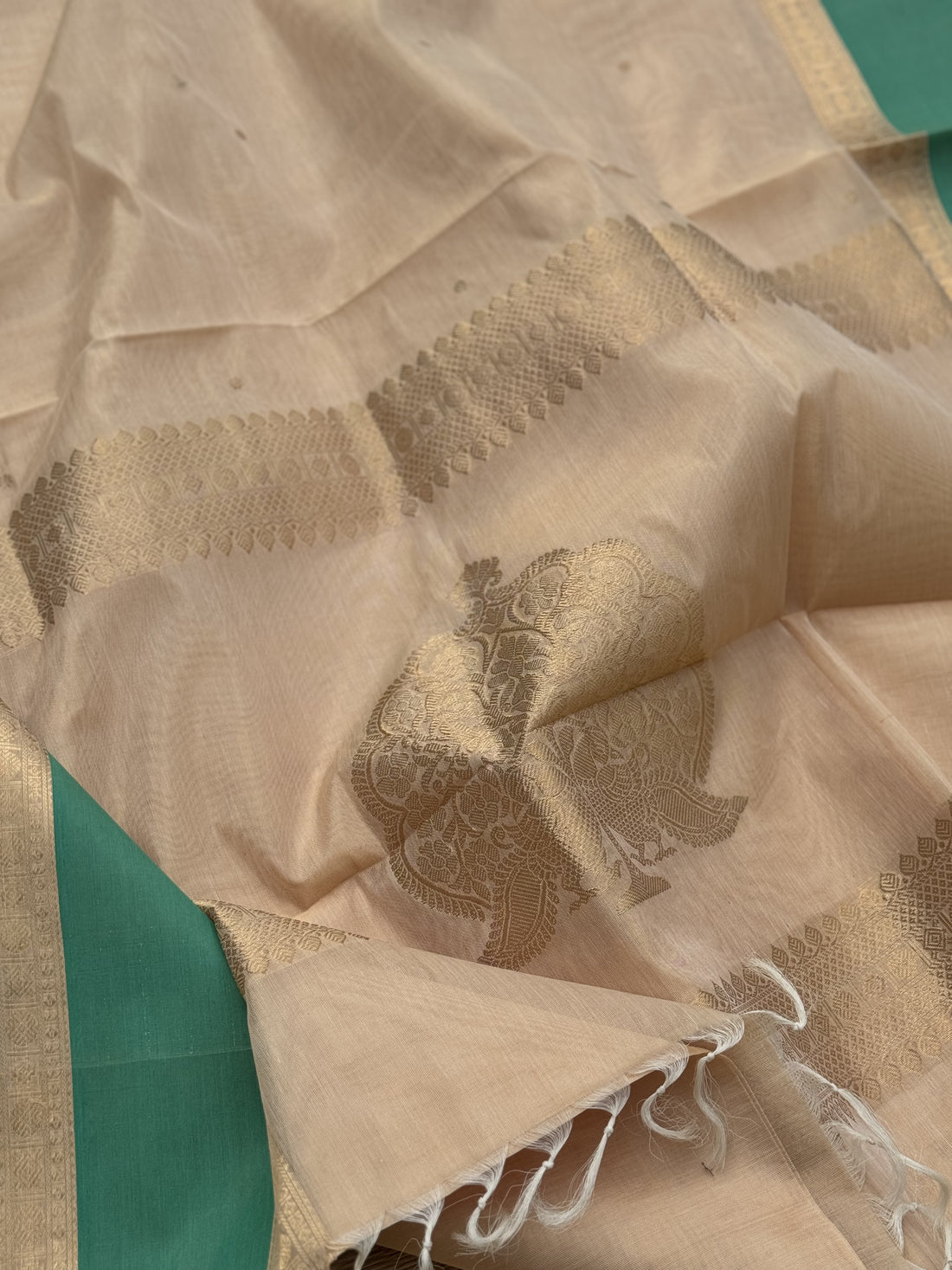 A gorgeous ivory gold shade handwoven Kanchi silk cotton saree