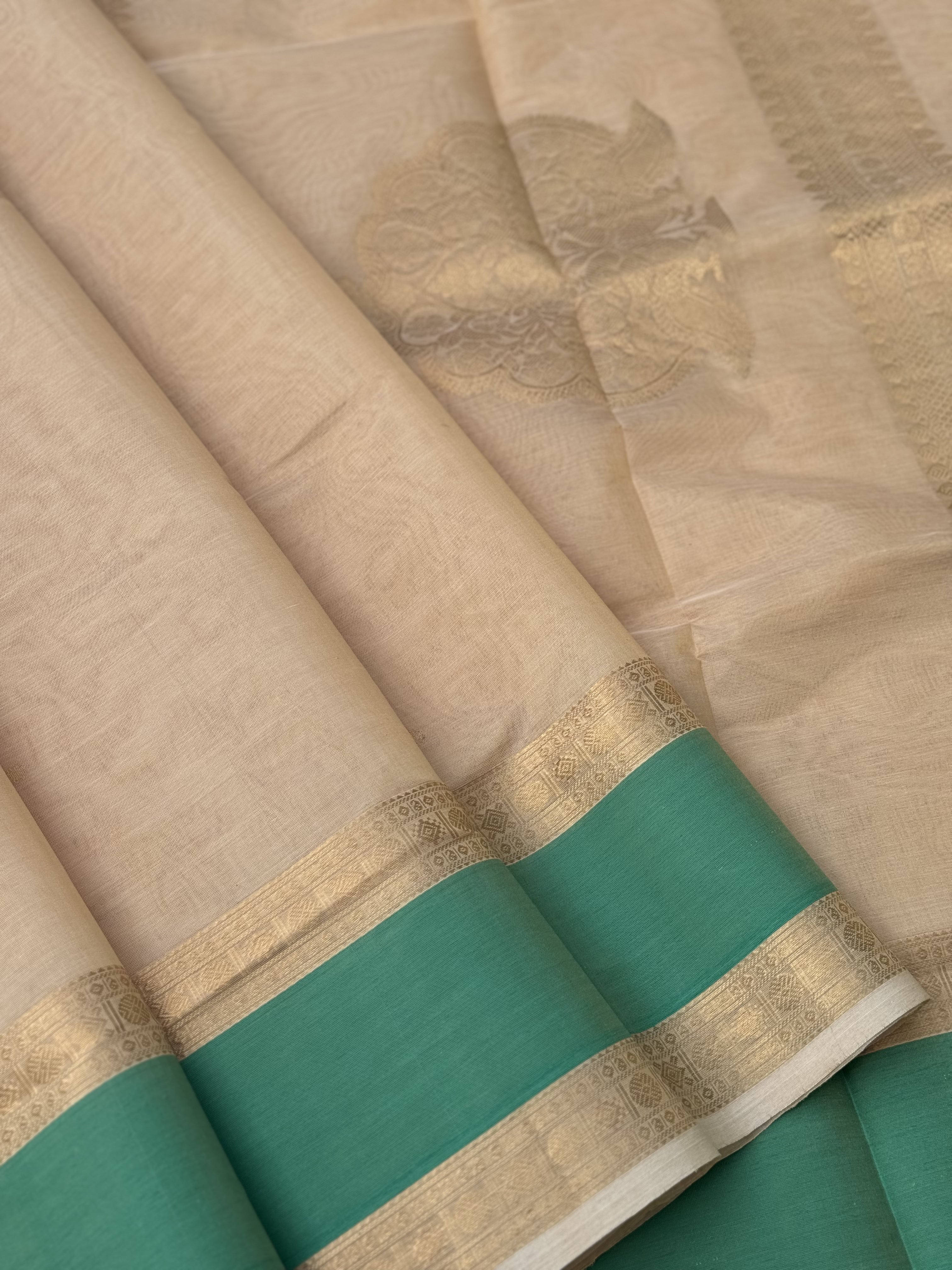 A gorgeous ivory gold shade handwoven Kanchi silk cotton saree