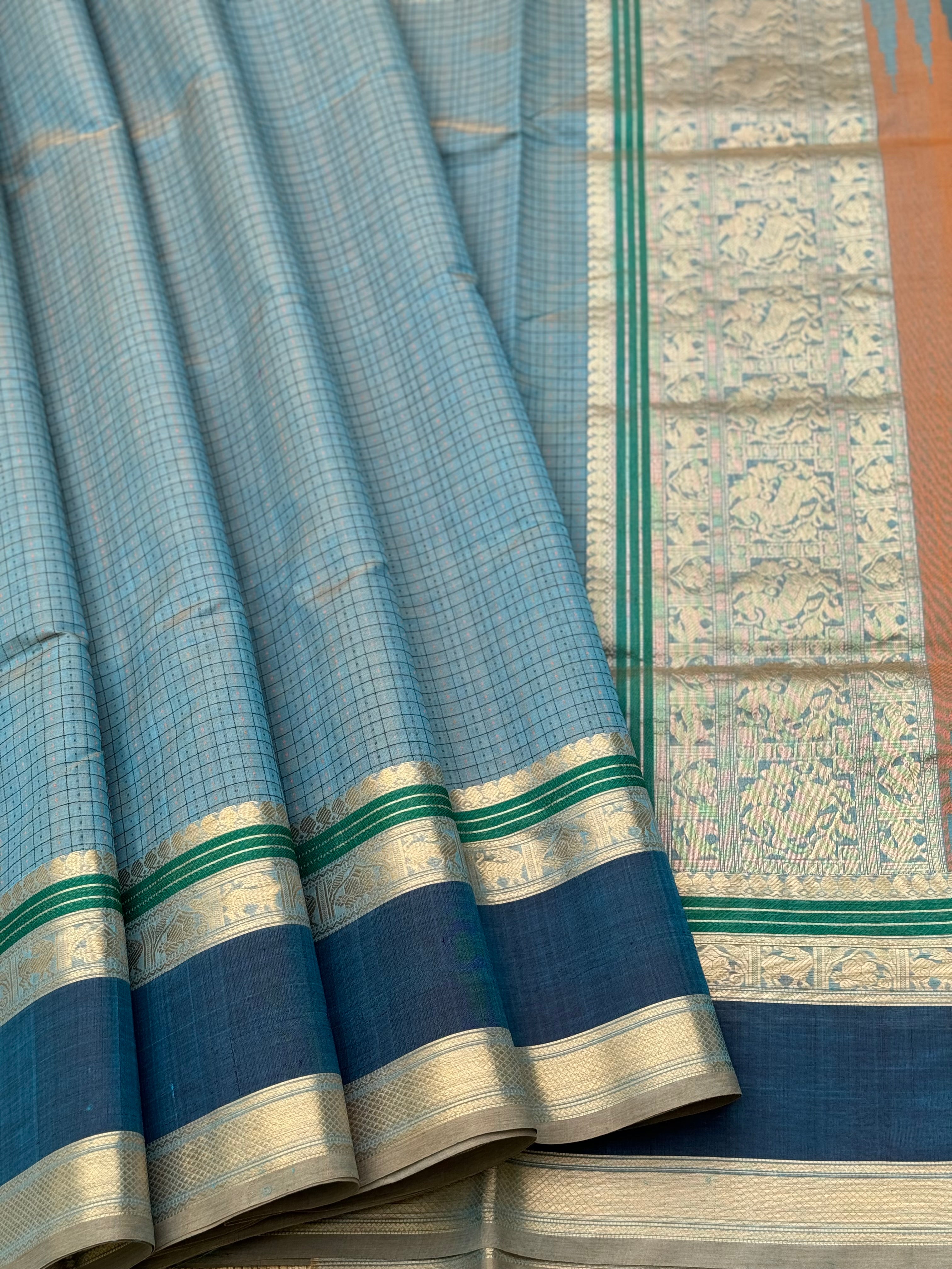 A gorgeous peacock blue shade handwoven lakshadeepam Kanchi silk cotton saree