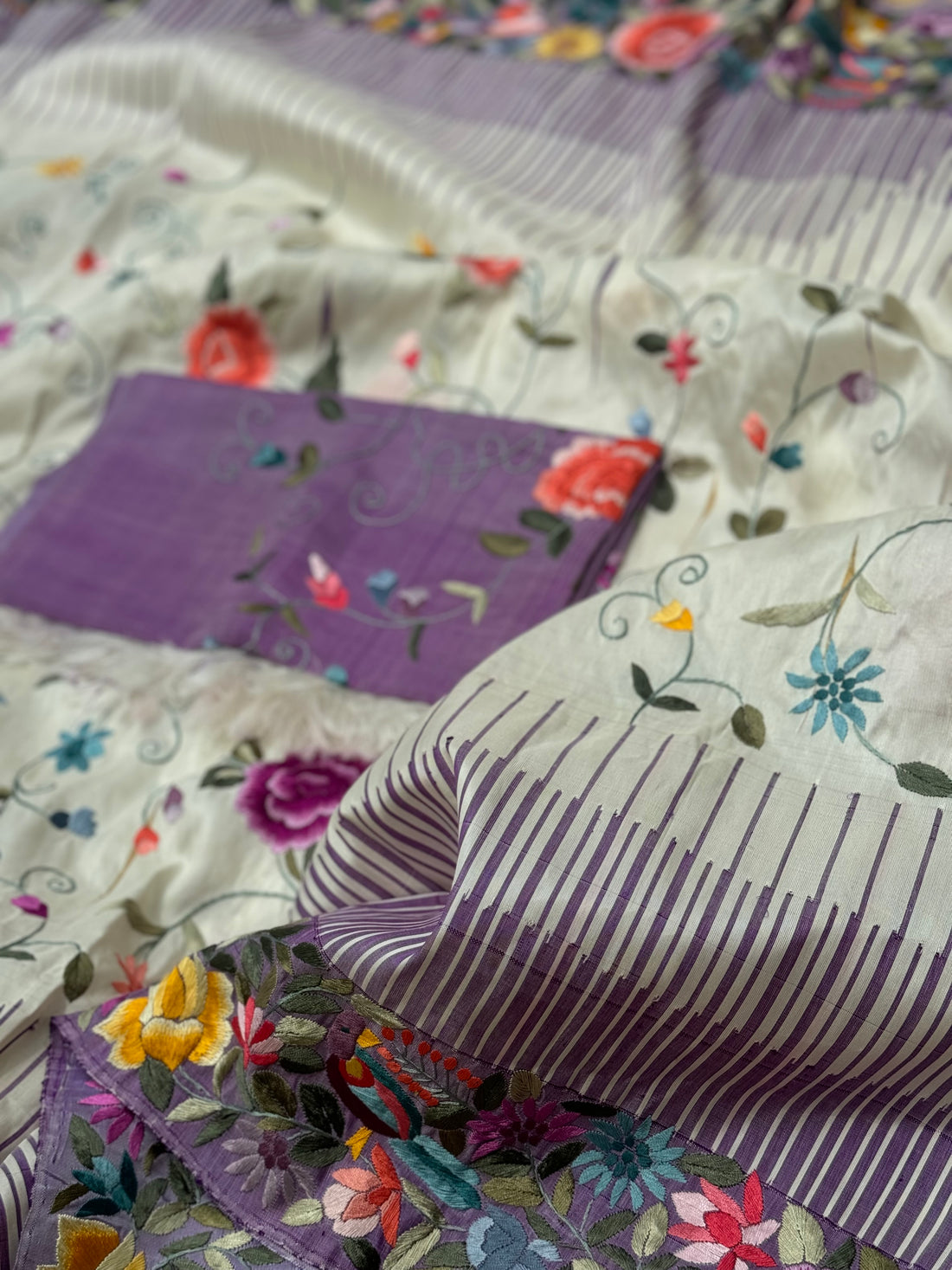 A stupendous kanchivaram silk saree in pastel lavender With authentic Parsi Gara work handmade