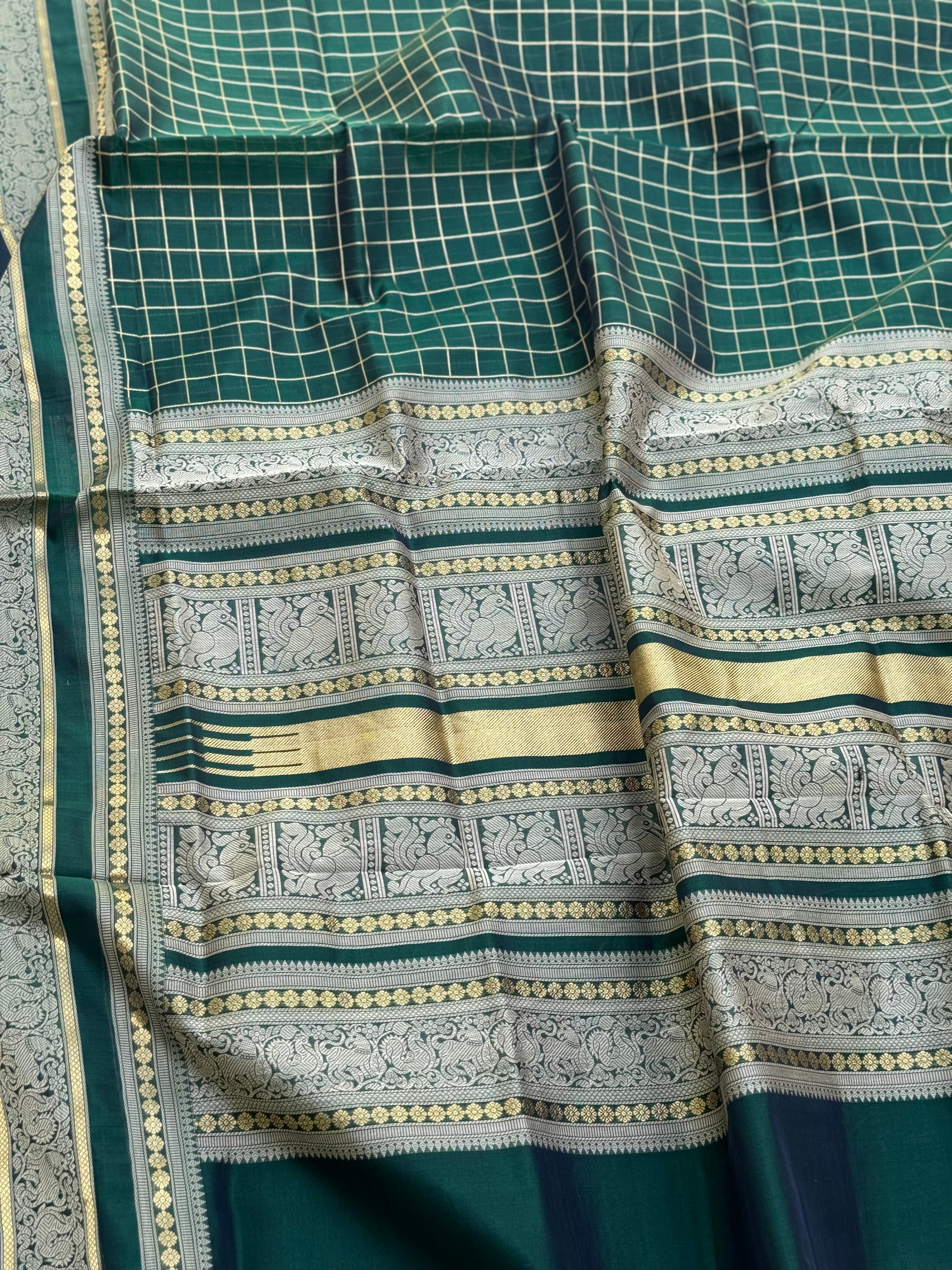 A gorgeous bottlegreen shade handwoven kattam Kanchi silk cotton saree