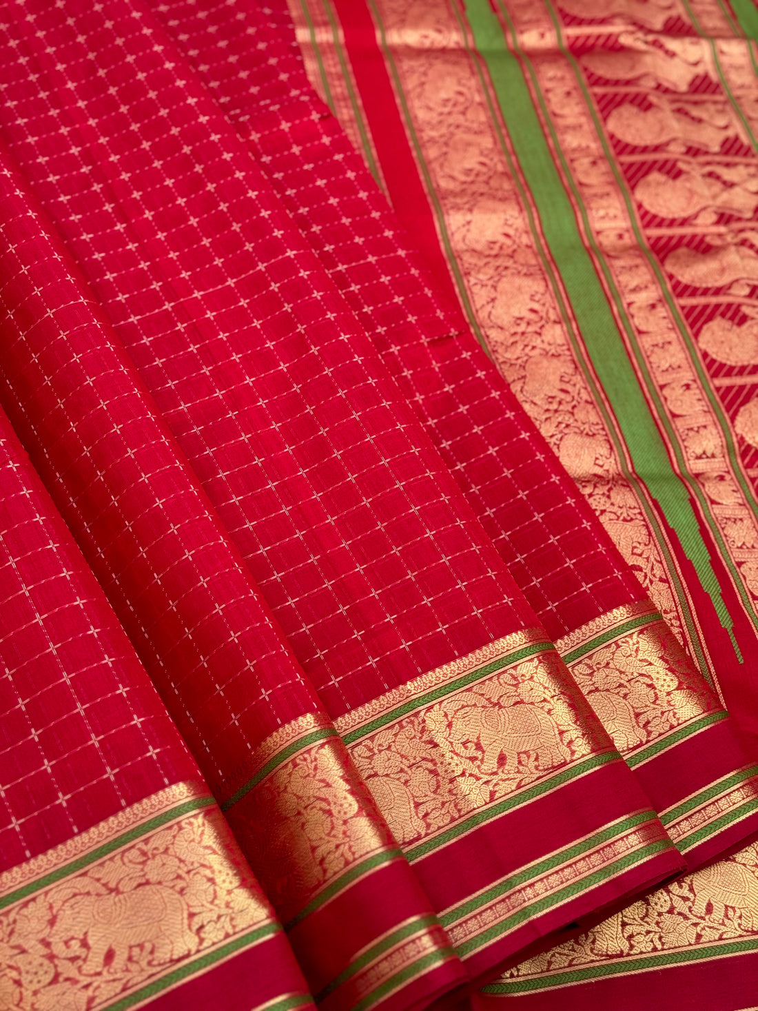 A gorgeous scarlet red shade handwoven plus buttas silk cotton saree