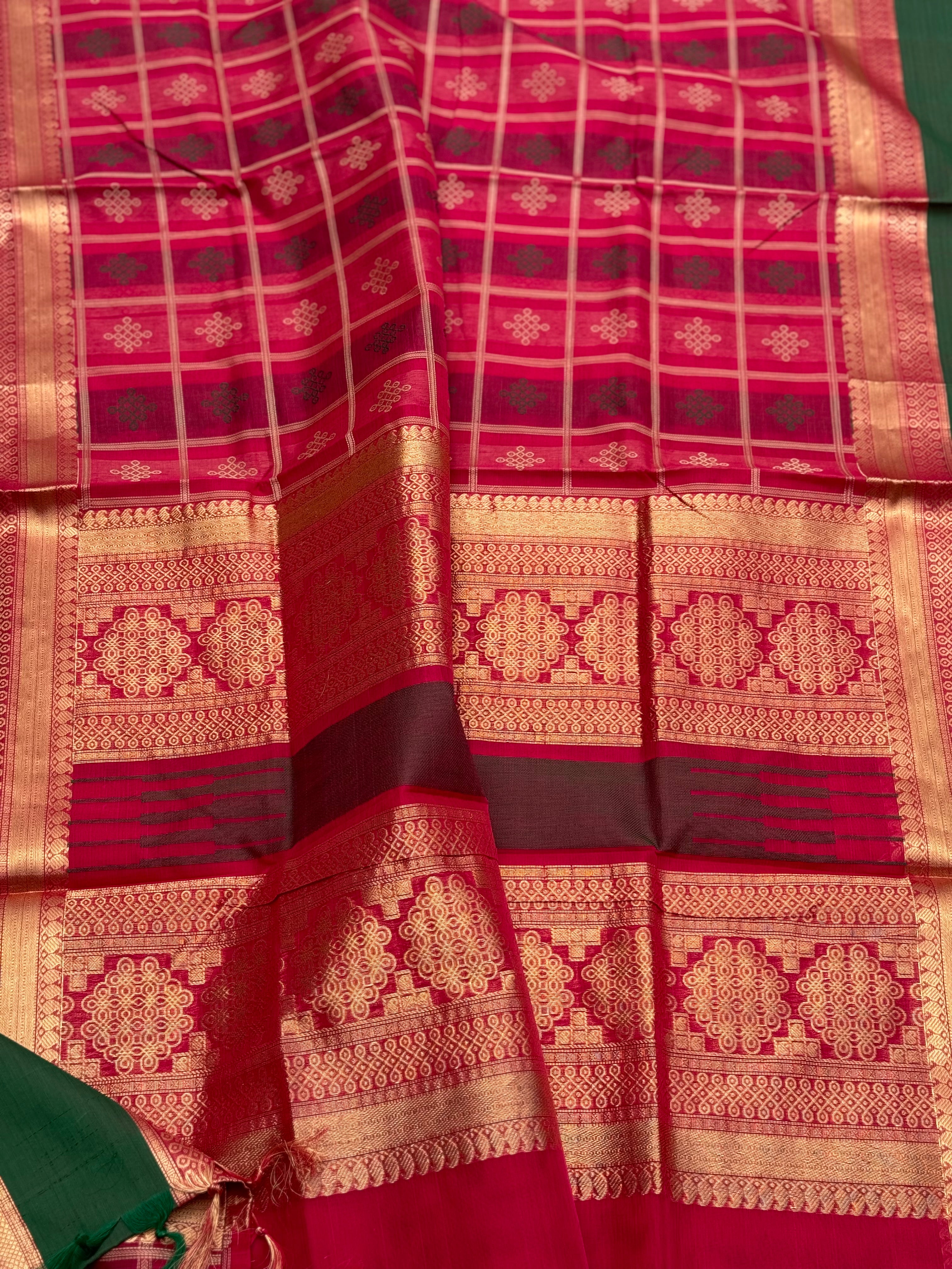 A gorgeous fuchsia pink shade handwoven kolam buttas silk cotton saree
