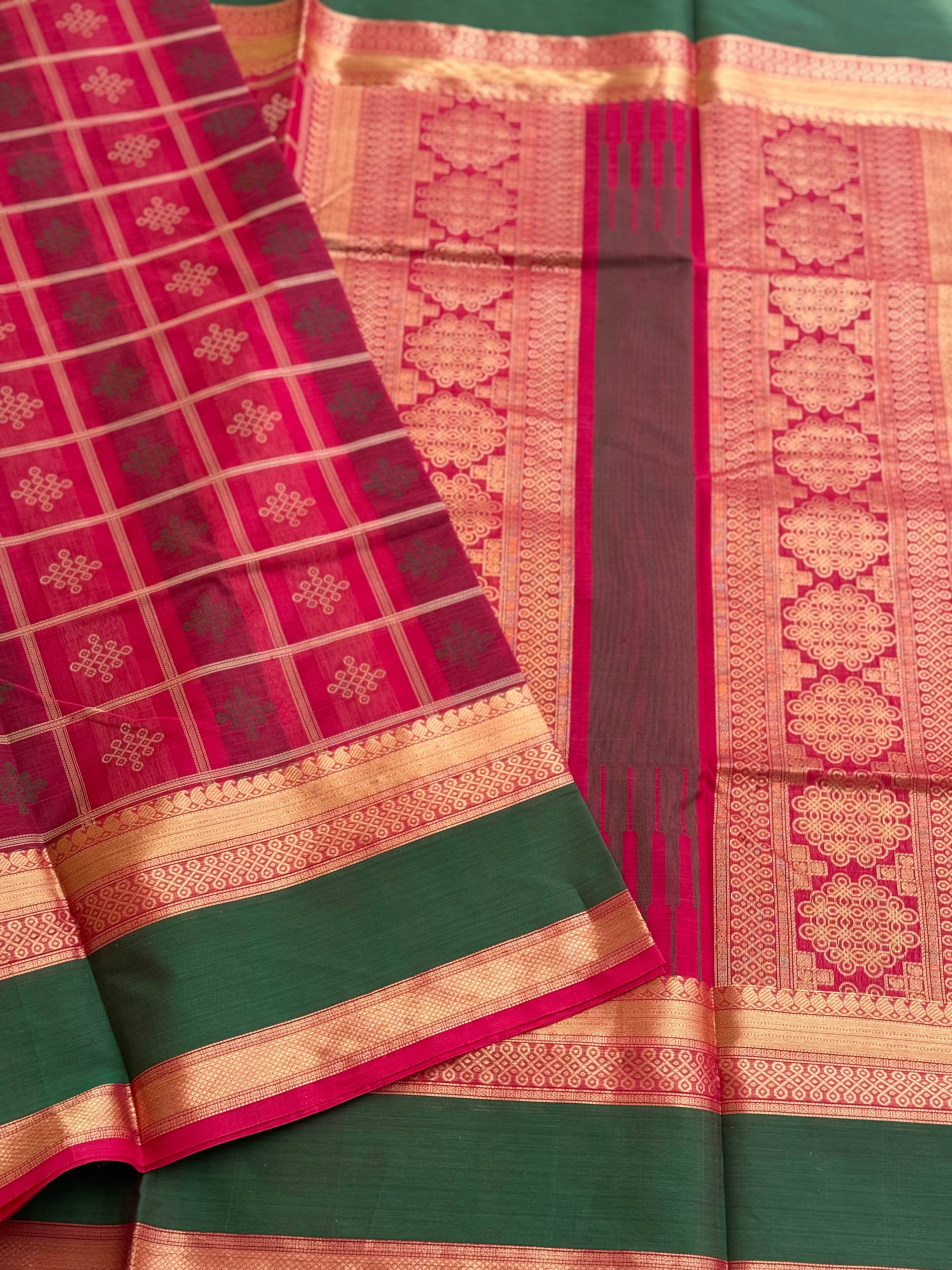 A gorgeous fuchsia pink shade handwoven kolam buttas silk cotton saree