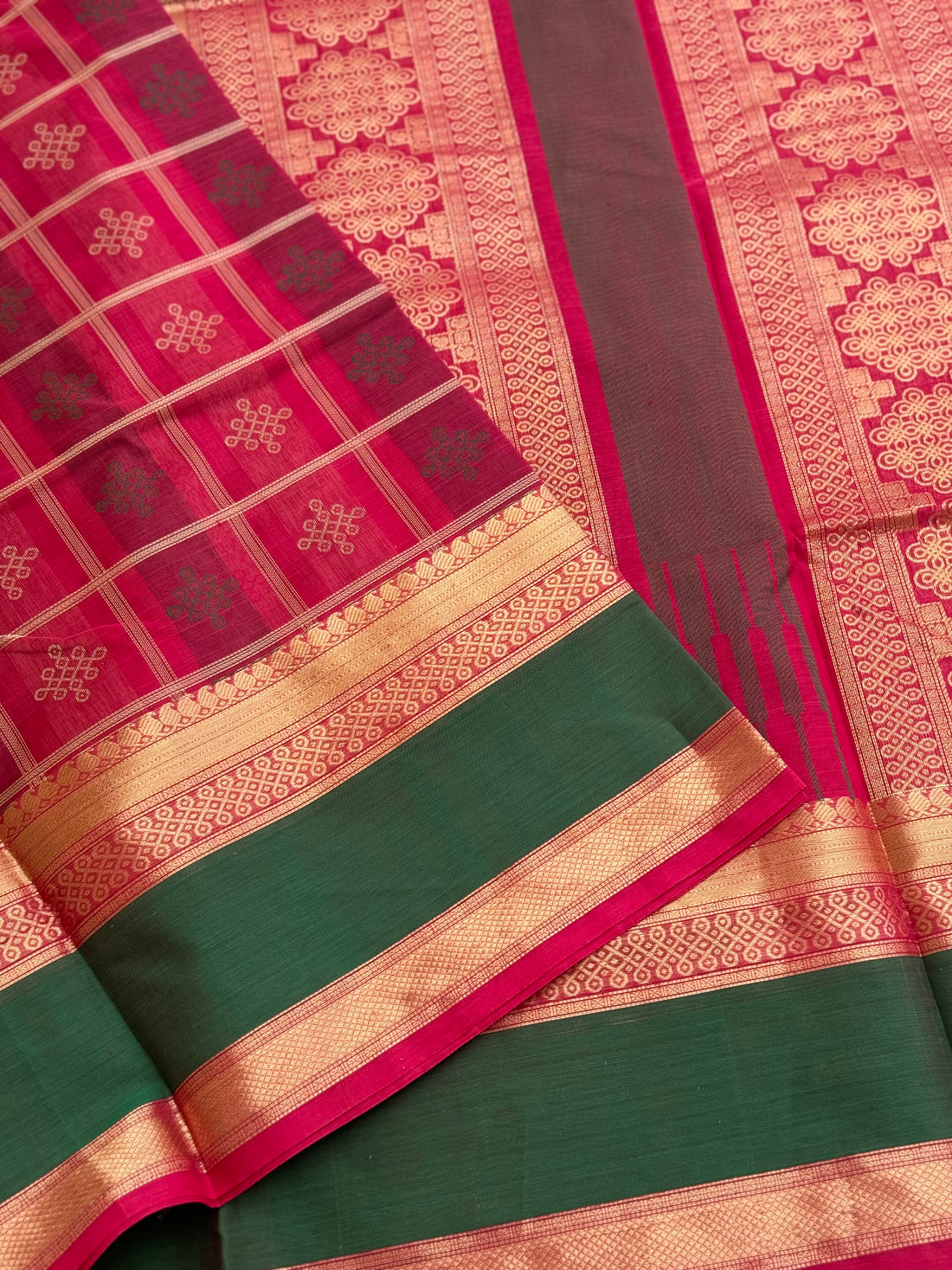 A gorgeous fuchsia pink shade handwoven kolam buttas silk cotton saree