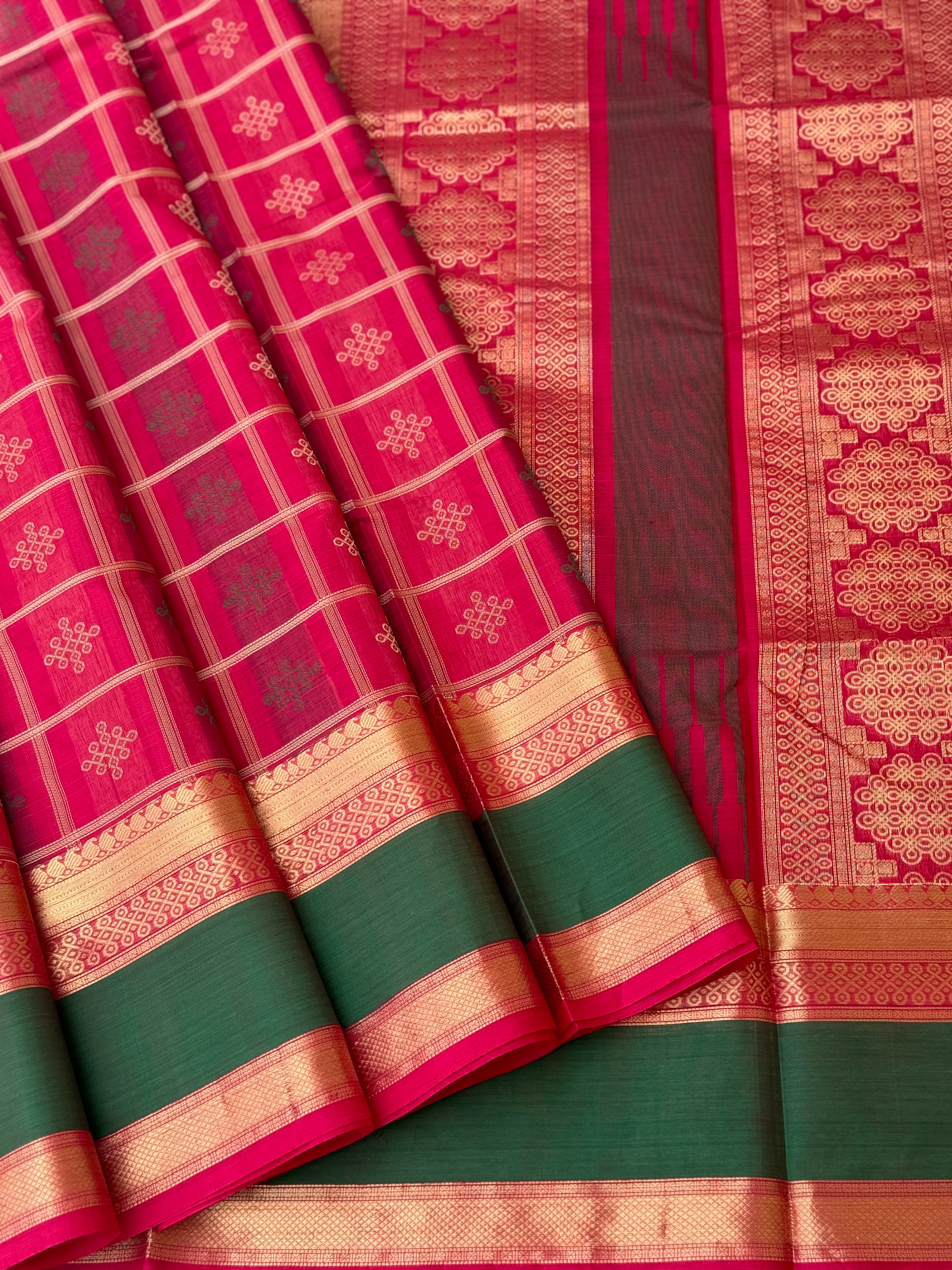 A gorgeous fuchsia pink shade handwoven kolam buttas silk cotton saree