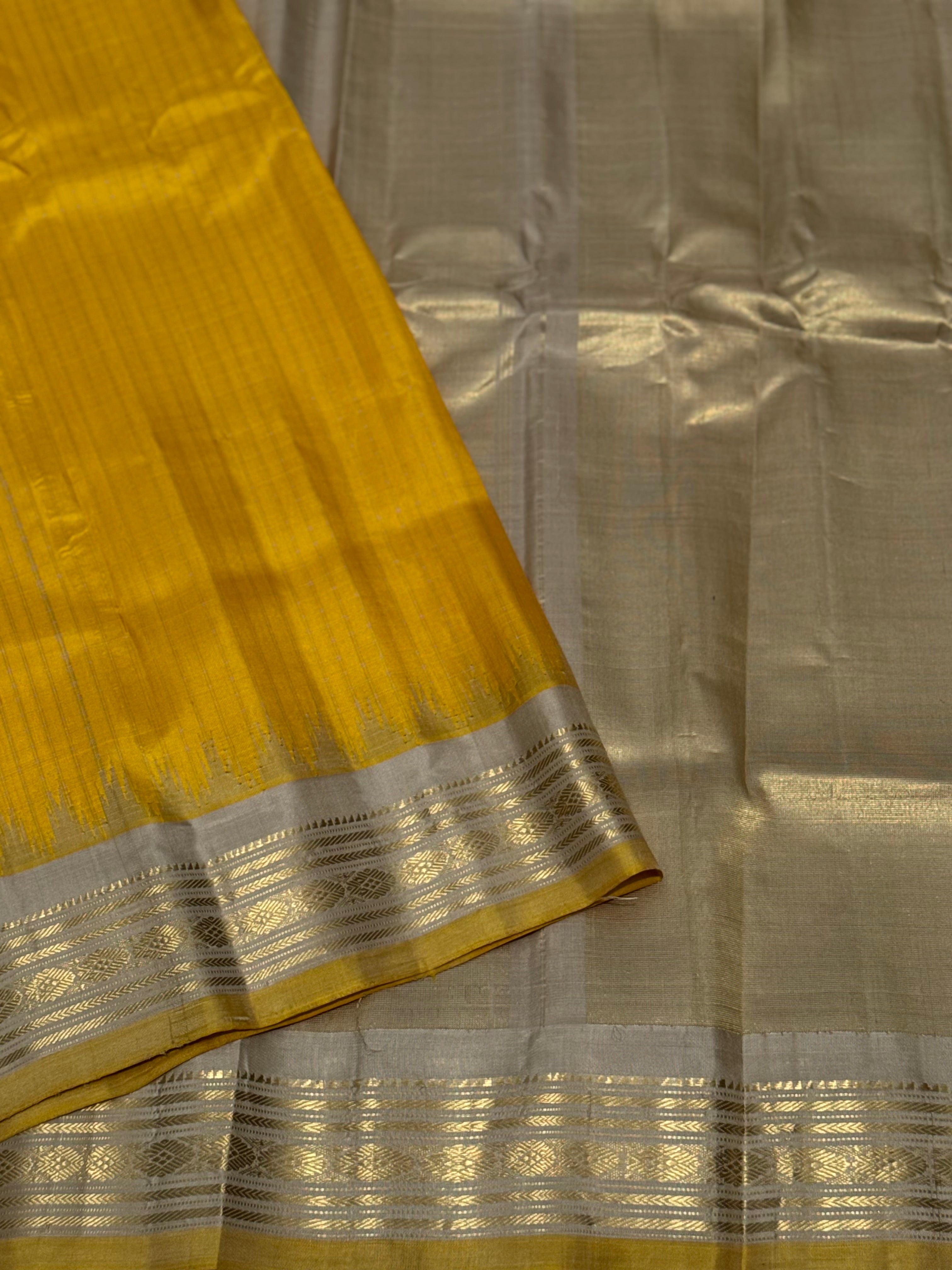 gorgeous offwhite with sunset yellow striped temple border kuttu handwoven gadwal silk saree
