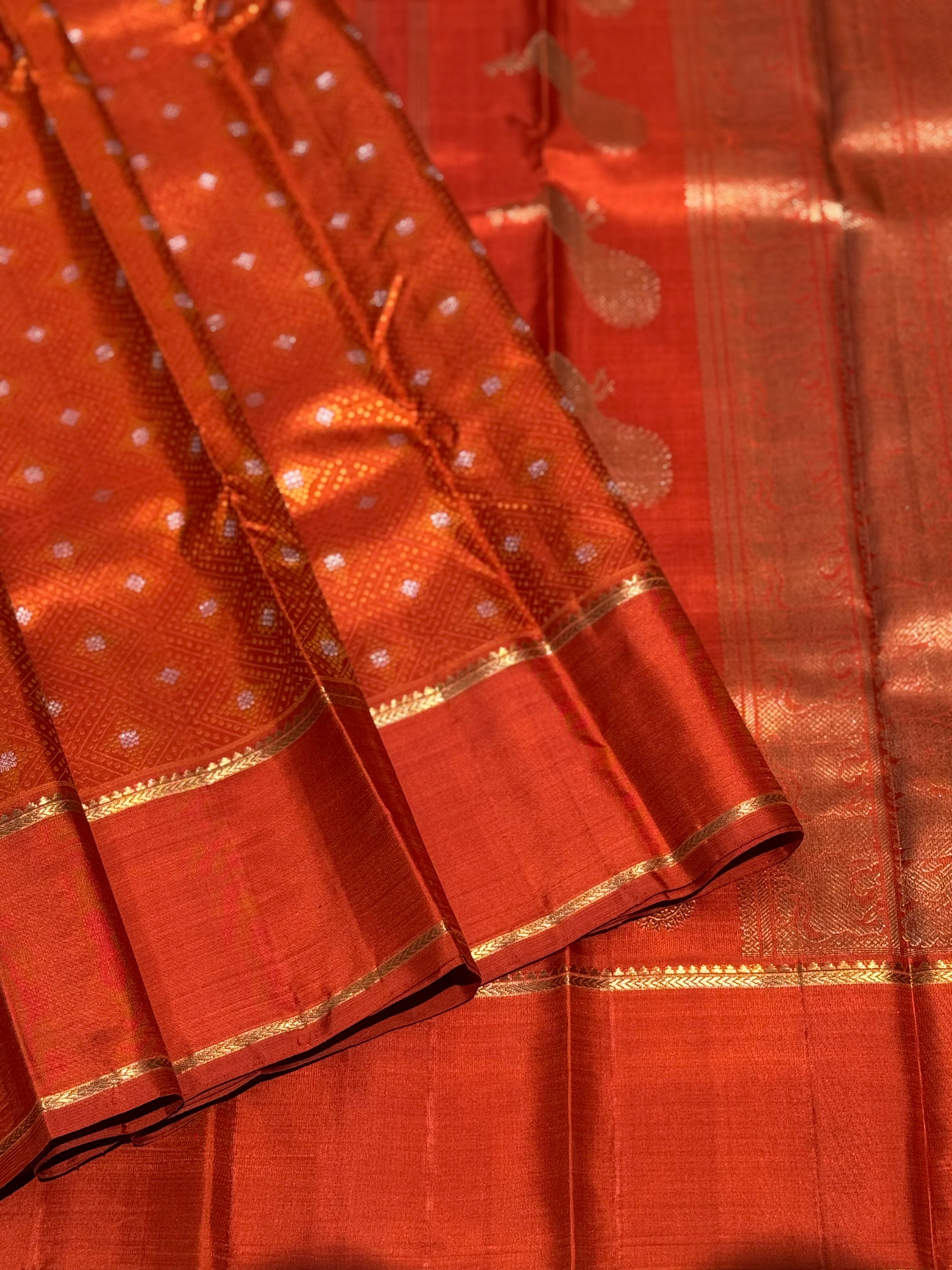 An awe inspiring masterpiece rustic orange shade bhandini inspired kanchivaram silk saree masterpiece