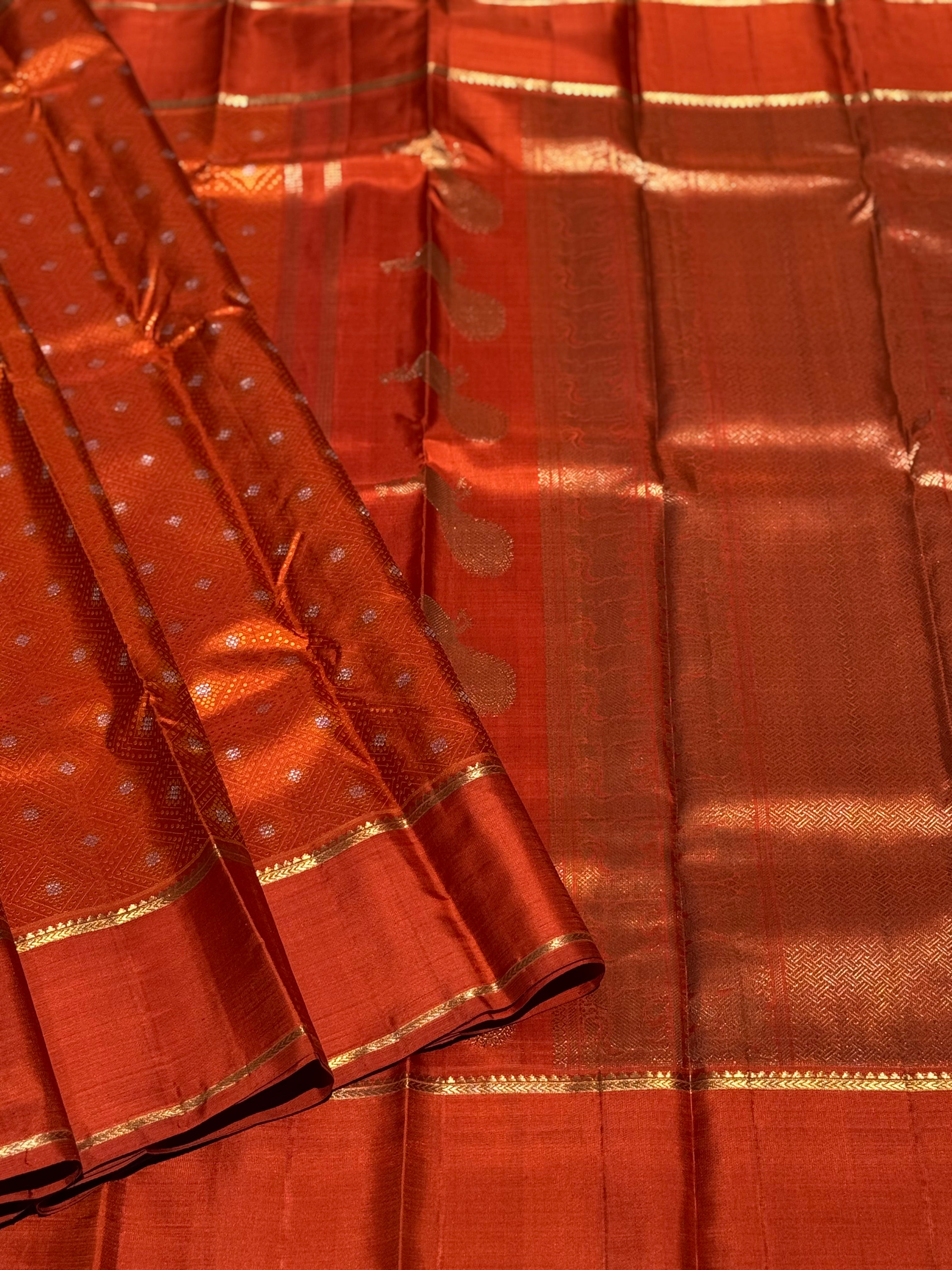 An awe inspiring masterpiece rustic orange shade bhandini inspired kanchivaram silk saree masterpiece