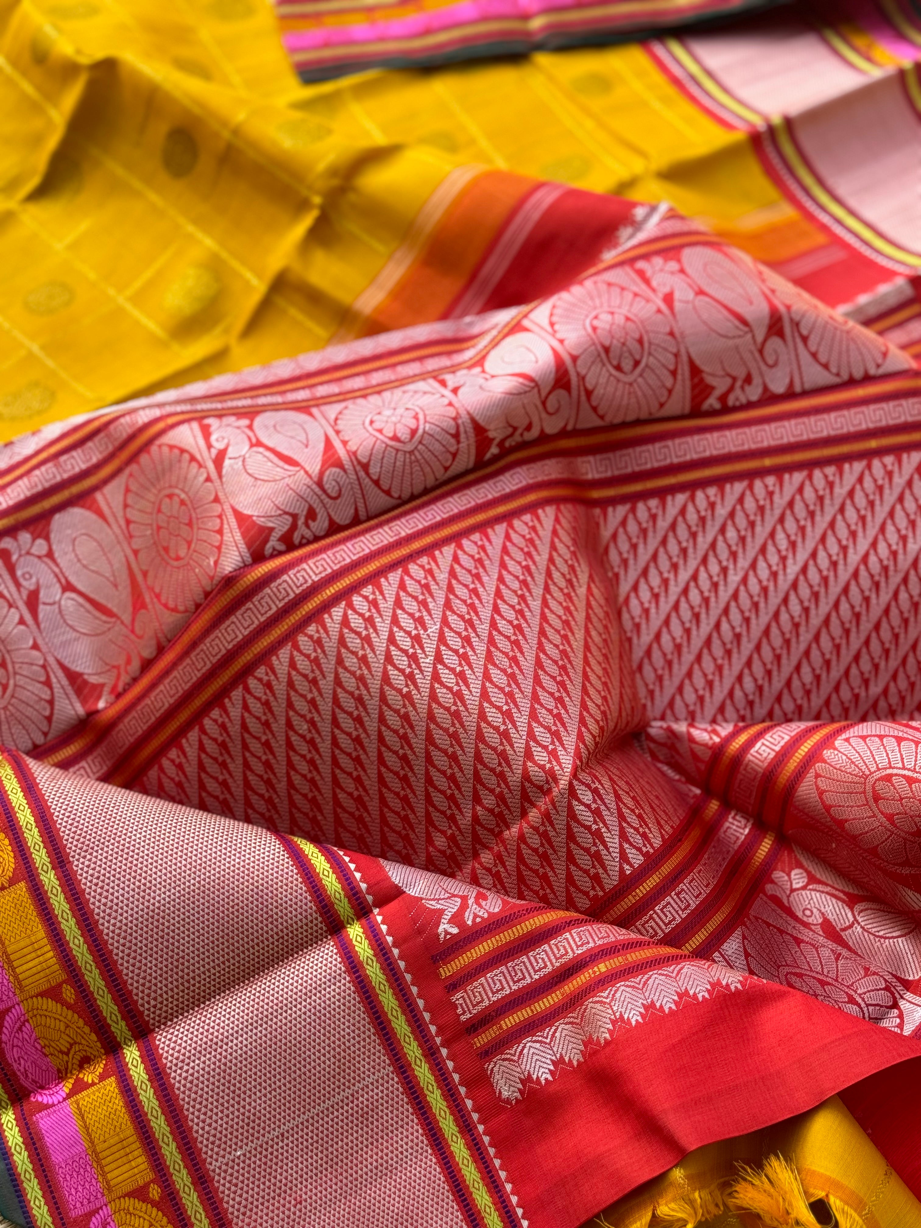 A stunner handwoven golden yellow shade with deep red Korvai kanchivaram silk saree with zari veldhari kattam