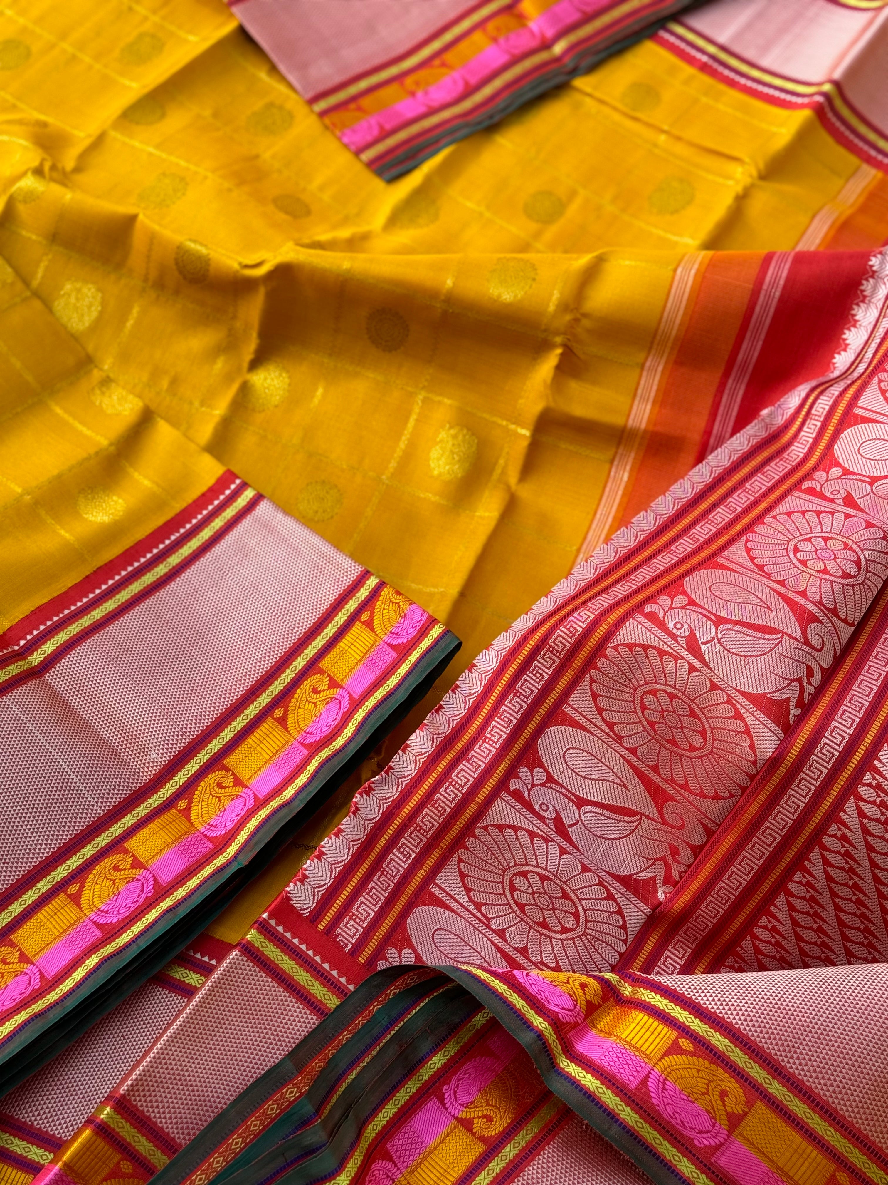 A stunner handwoven golden yellow shade with deep red Korvai kanchivaram silk saree with zari veldhari kattam