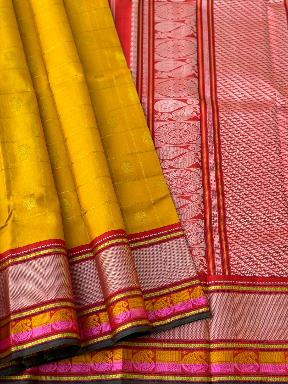 A stunner handwoven golden yellow shade with deep red Korvai kanchivaram silk saree with zari veldhari kattam