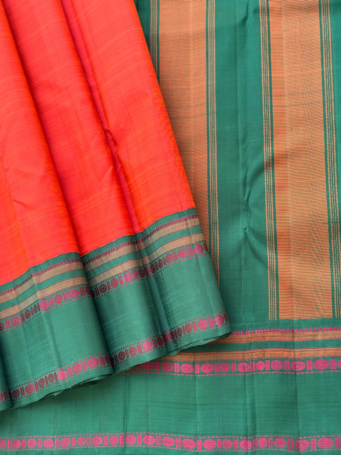 A subtle handwoven dark peach shade with green Threadwork Kai korvai kanchivaram silk saree