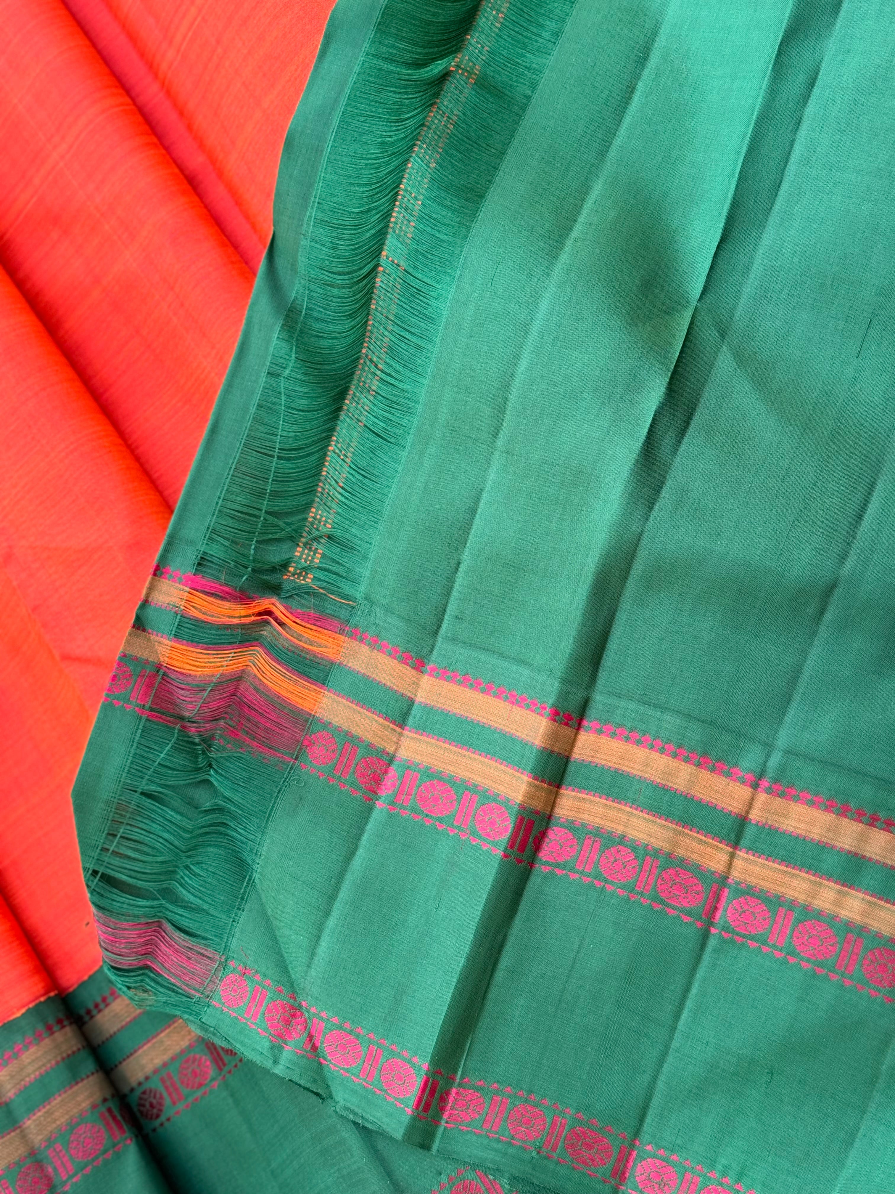 A subtle handwoven dark peach shade with green Threadwork Kai korvai kanchivaram silk saree