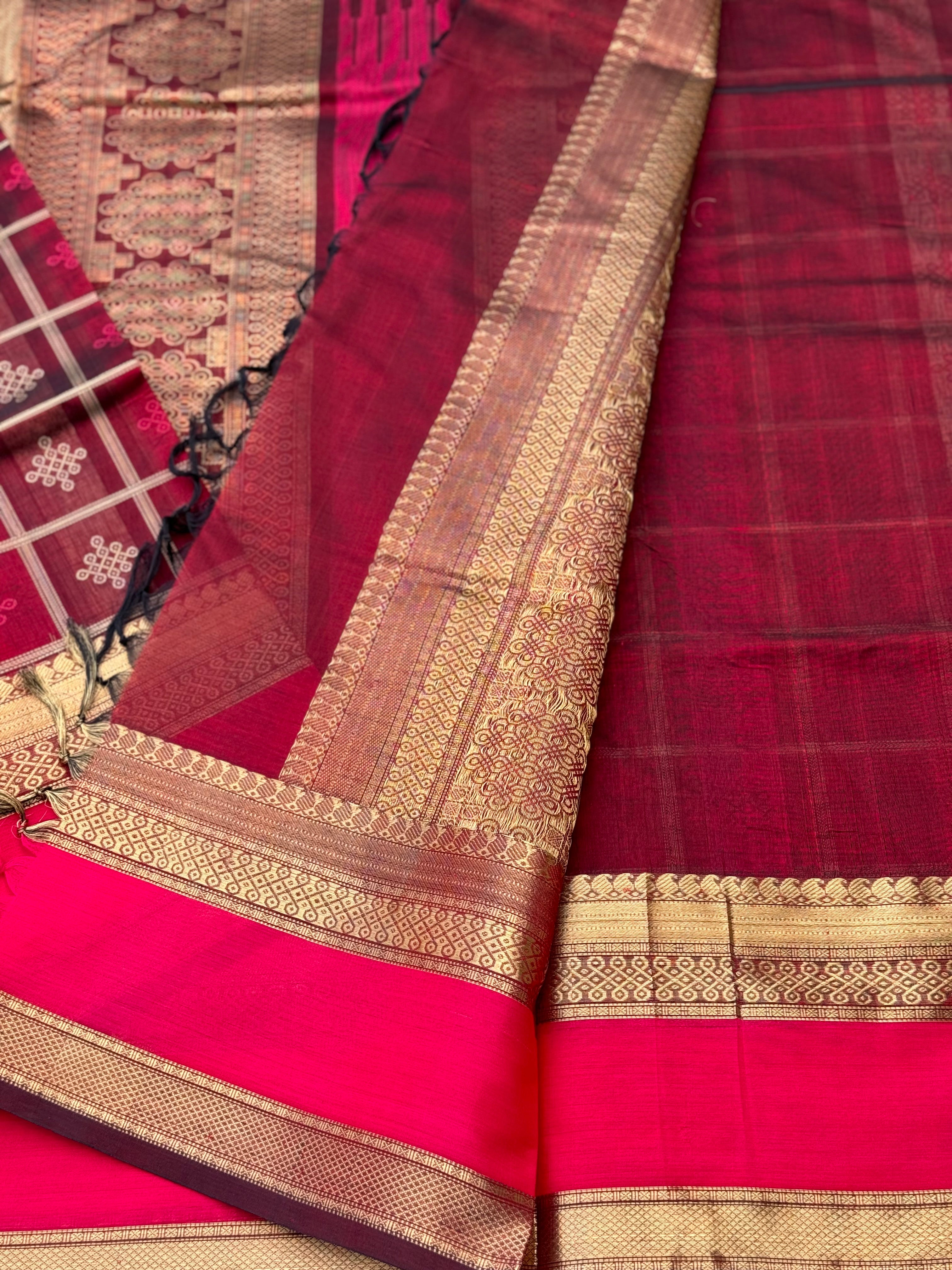 A gorgeous burgundy shade handwoven kolam buttas silk cotton saree